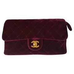 1990s Chanel burgundy velvet gold hardware backpack