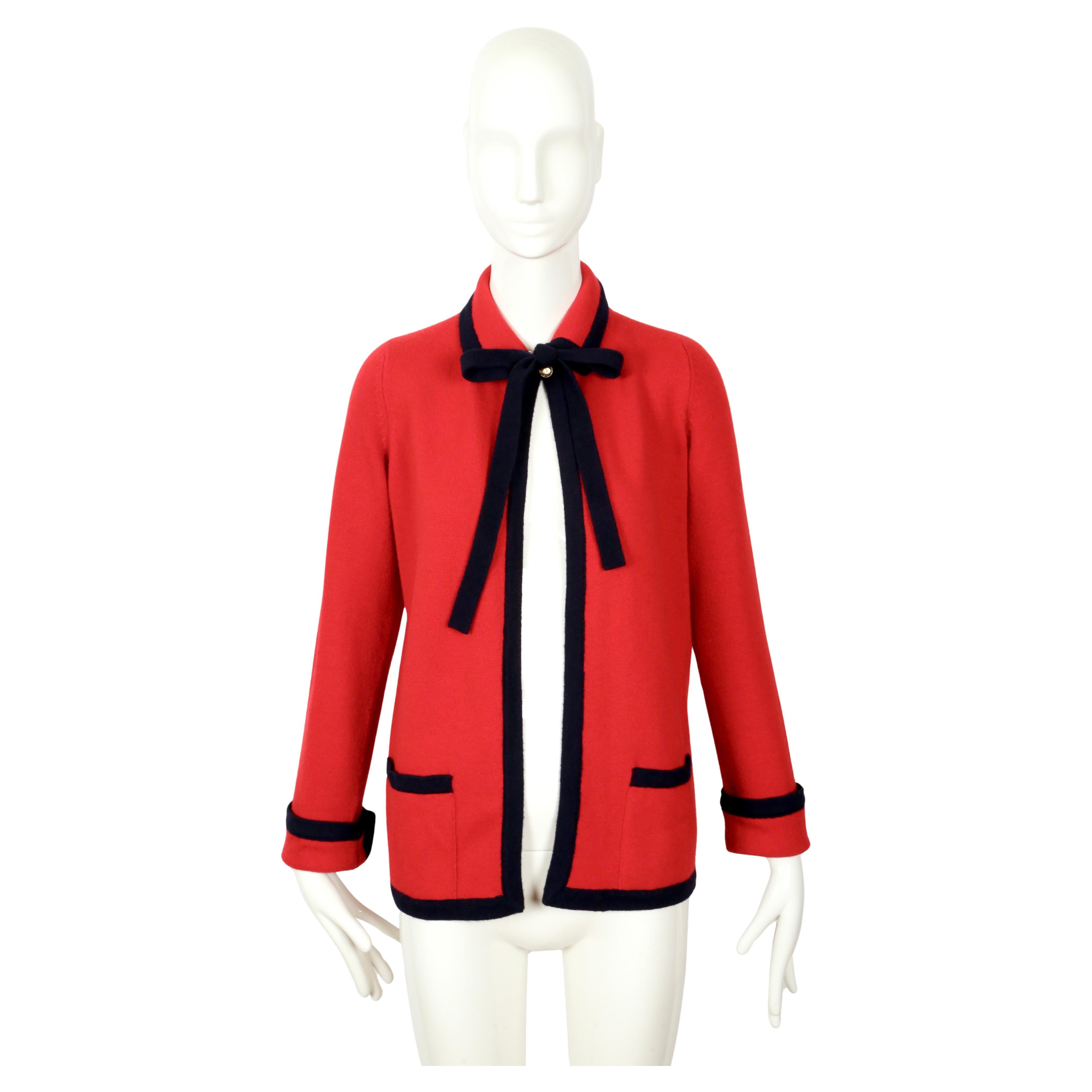 Classic red and deep navy blue cashmere cardigan with necktie and gold 'CC' buttons from Chanel dating to the early 1990's. No size is indicated although this best fits a S or M. Approximate measurements: shoulder 13.5