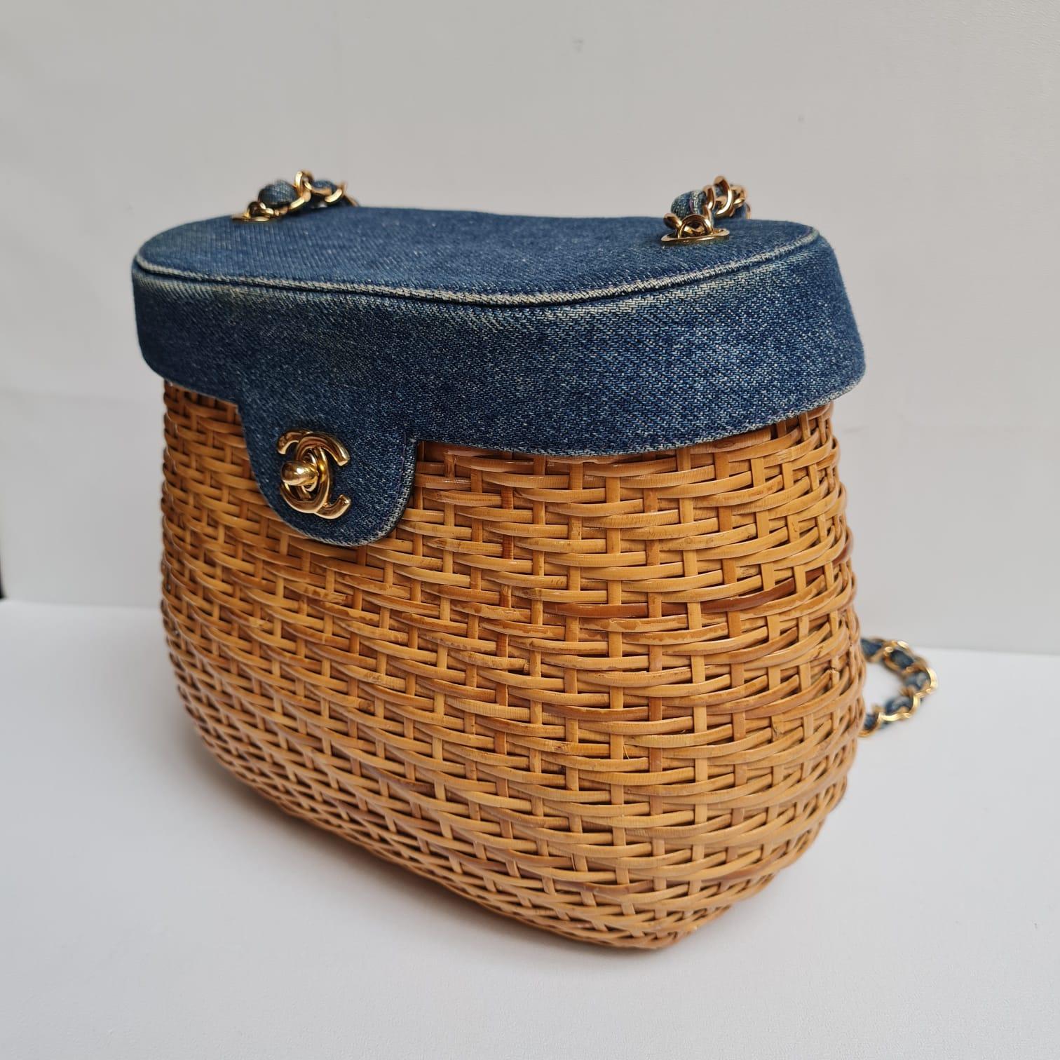 Rare vintage denim rattan shoulder bag.  Visible scratches on the leather lining. Overall in good condition still. Item is series #5. Comes as is.