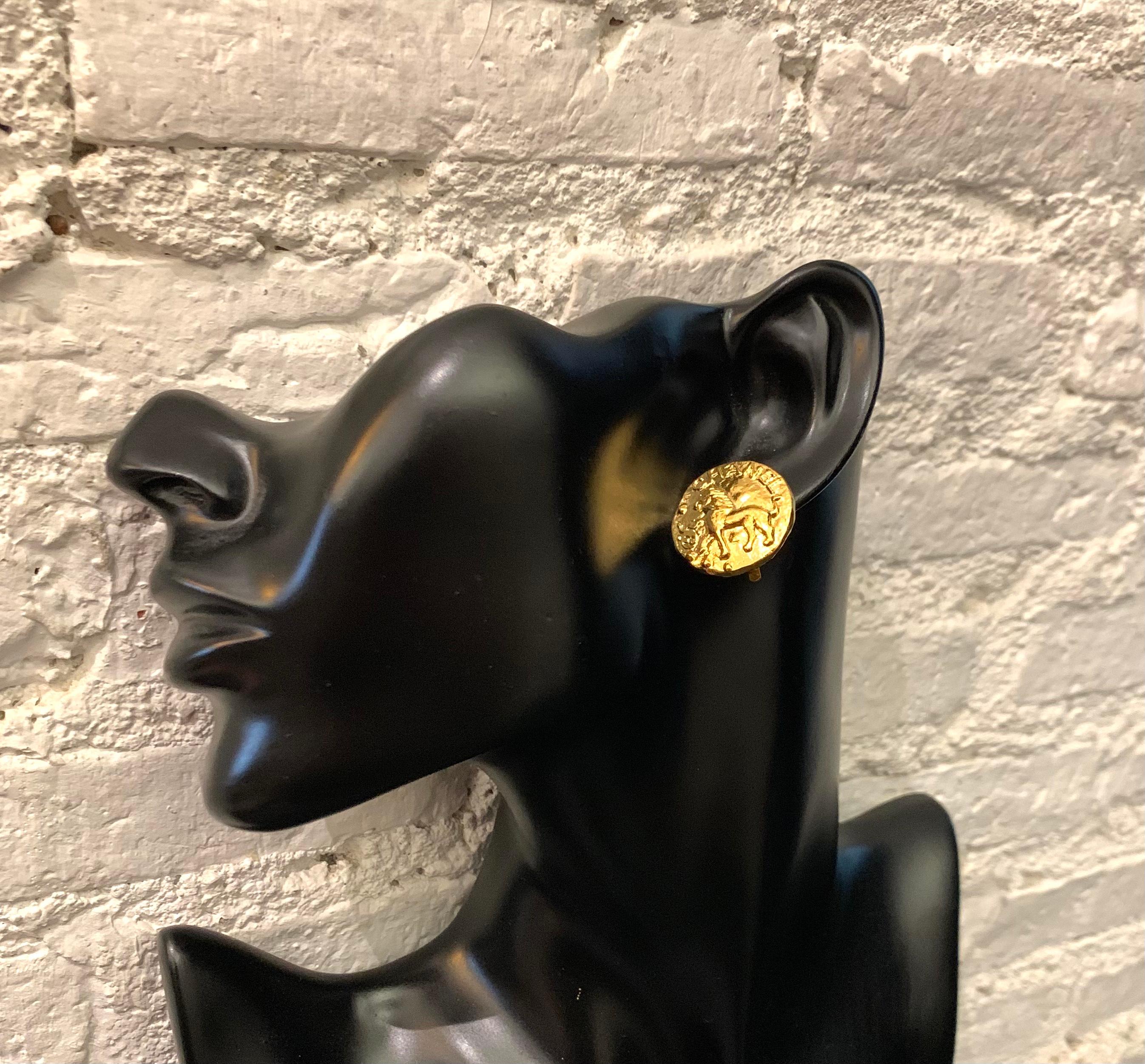 1980s CHANEL gold toned clip-on earrings featuring a lion motif. Proud and regal, the lion has been used a reflection of Gabrielle Chanel's own power and independence. It also evokes her love for Venice, the city she visited often, and whose felines