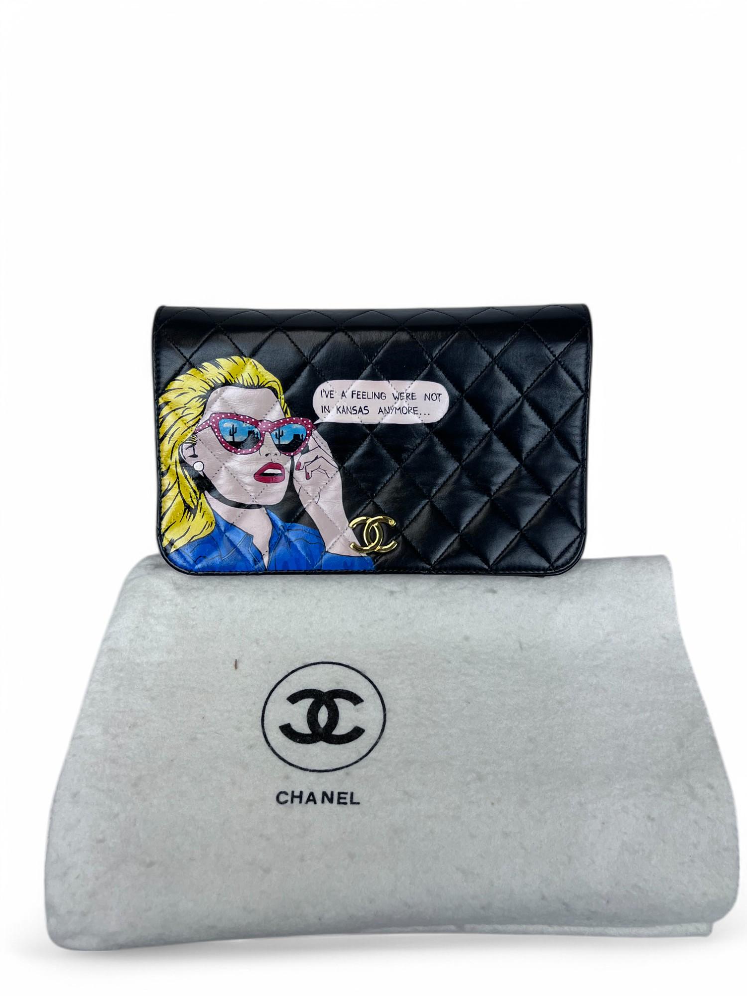 This 1990s Chanel shoulder bag has been transformed into a one-of-a-kind art piece by a contemporary pop artist. Featuring the whimsical and thought-provoking hand-painted phrase 