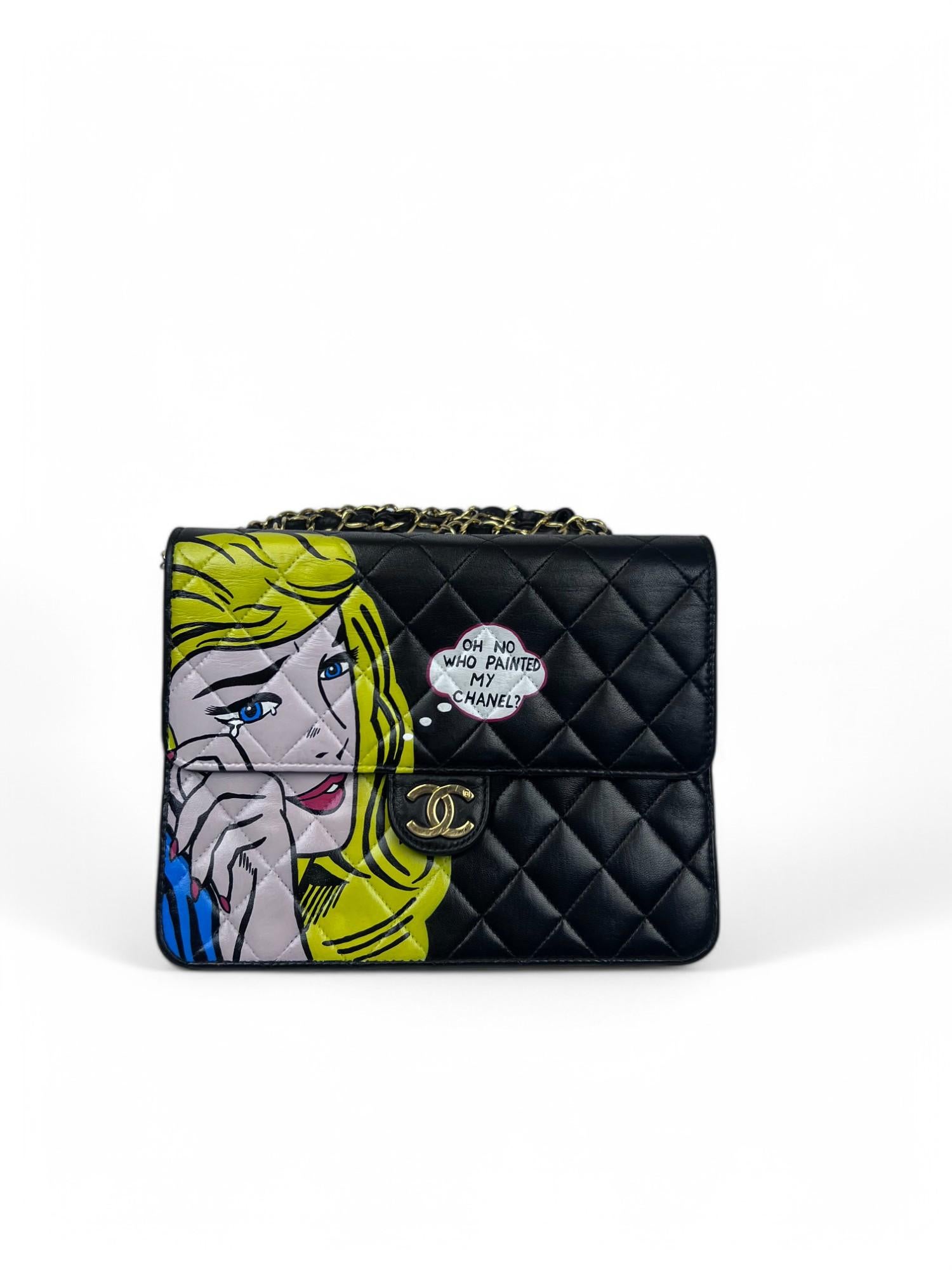 This 1990s Chanel shoulder bag has been transformed into a striking pop art masterpiece.  Featuring the playful and provocative hand-painted phrase 