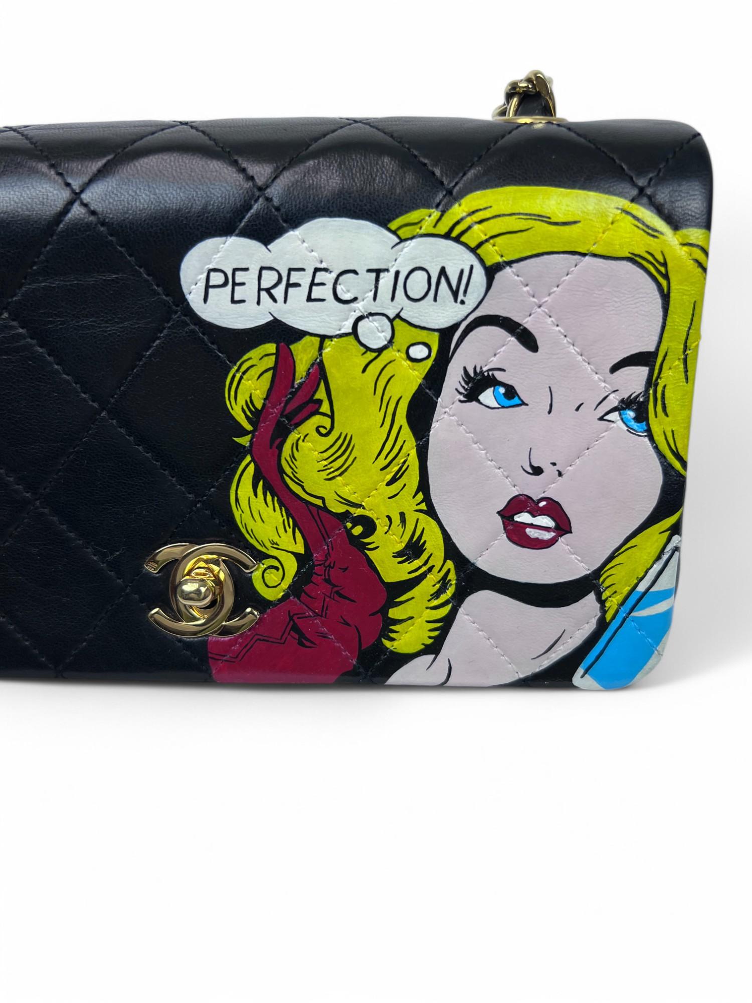 This 1990s Chanel mini crossbody bag has been reimagined into a bold statement piece by a contemporary pop artist. Featuring the striking hand-painted word 