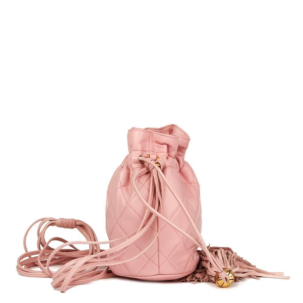 CHANEL
Pink Quilted Lambskin Vintage Timeless Bucket Bag

Reference: HB1812
Serial Number: 1990813
Age (Circa): 1990
Accompanied By: Chanel Dust Bag
Authenticity Details: Serial Sticker (Made in Italy)
Gender: Ladies
Type: Shoulder,