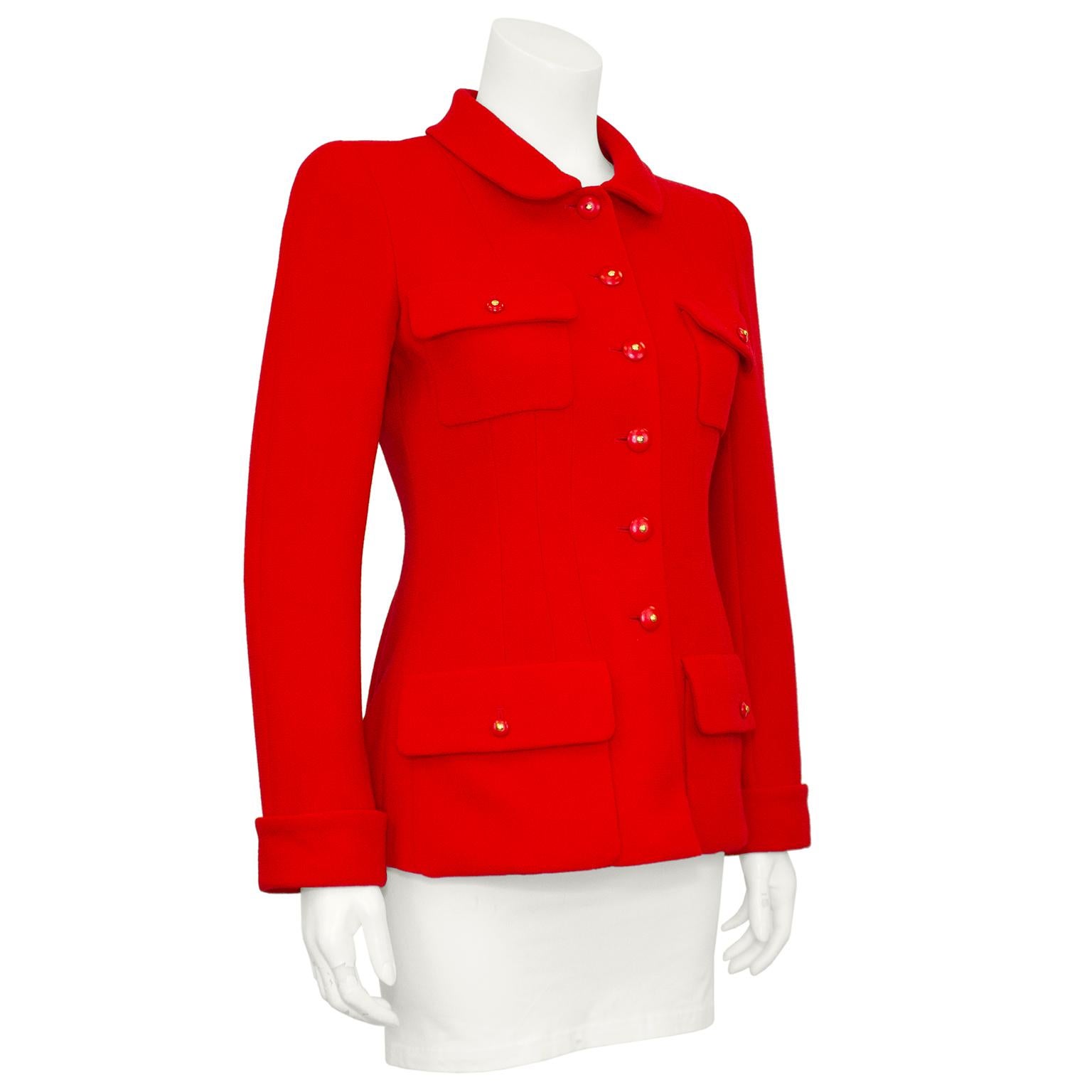 This 1990s Chanel jacket is classic and timeless. Dating from the early 1990s, this Chanel jacket is a striking bright red boucle. Rounded Peter Pan collar with two patches pockets at the bust and two patch pockets at the hips. Folded cuffs and