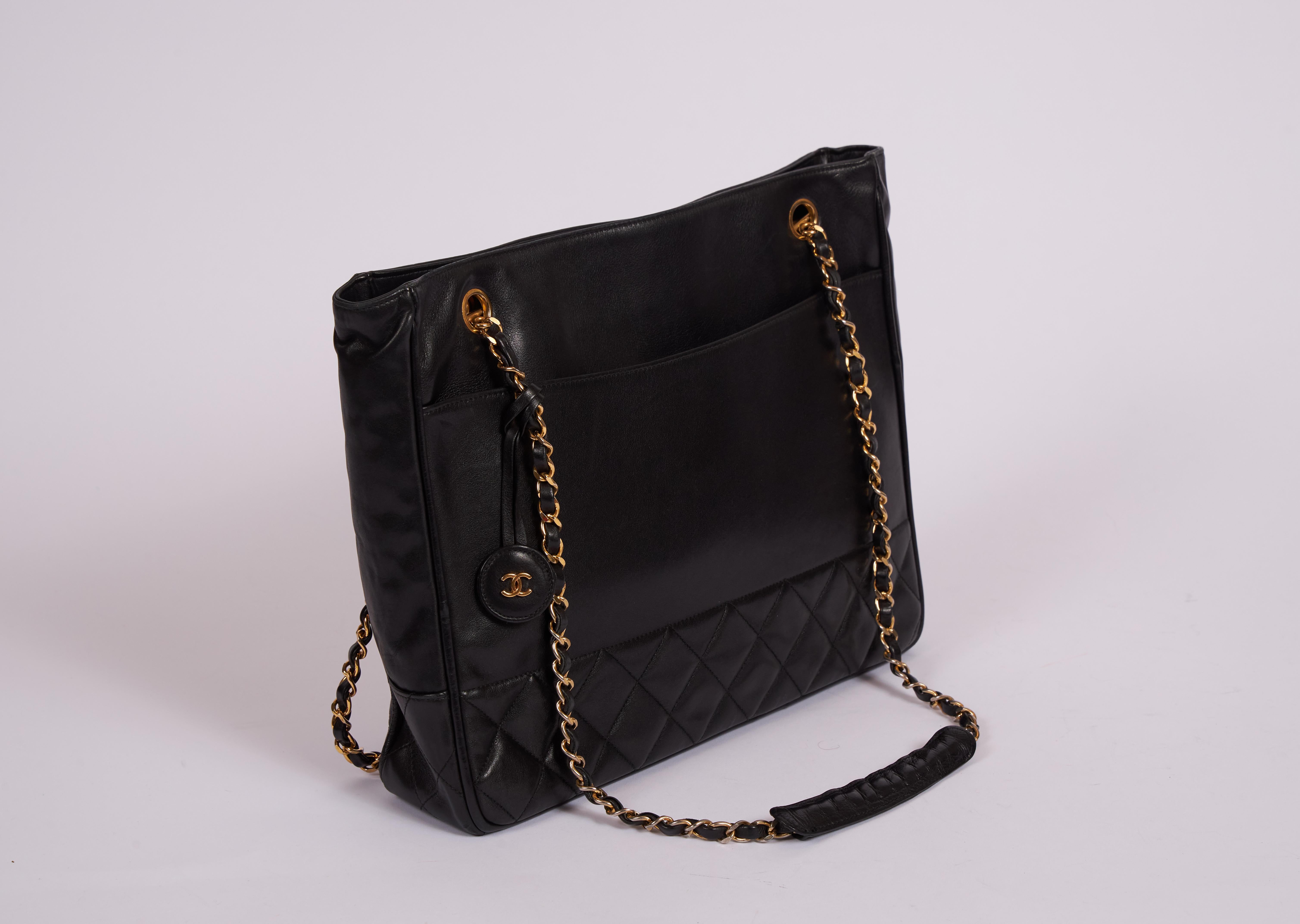 Chanel 90s black lambskin shoulder tote with quilted bottom and gold tone hardware. Shoulder drop 13