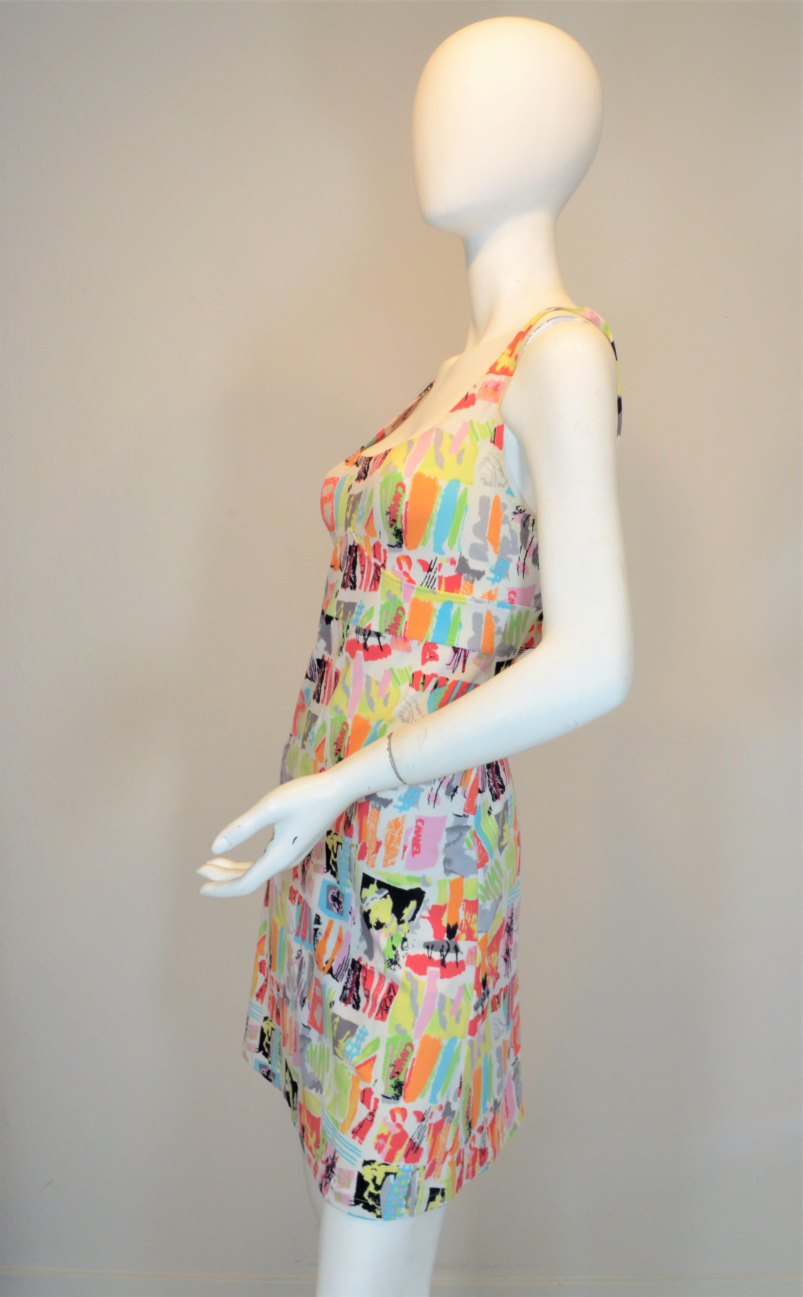 Chanel 1990's print dress features a multicolor graffiti print on a stretchy jersey fabric. Dress has a defined bust area and an open back. Dress is in good vintage condition with normal wears due to age.

Measurements: 
Bust 34”, waist 30”, hips
