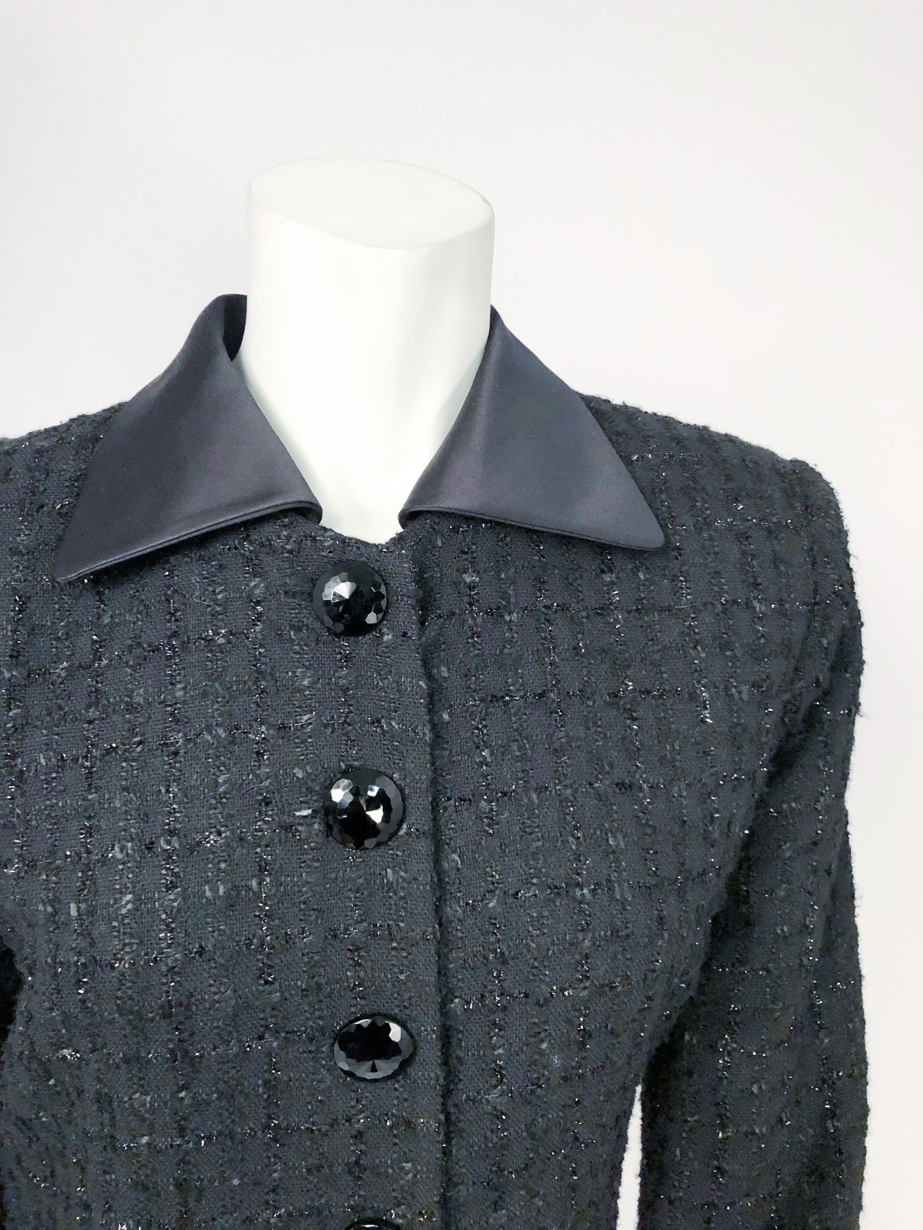 1990s Christian Dior Black and black Metallic Tweed Suit with oversized glass buttons, satin collar and winged cuffs. The collar and cuffs are removable to make this ensemble wearable during the day and the night.