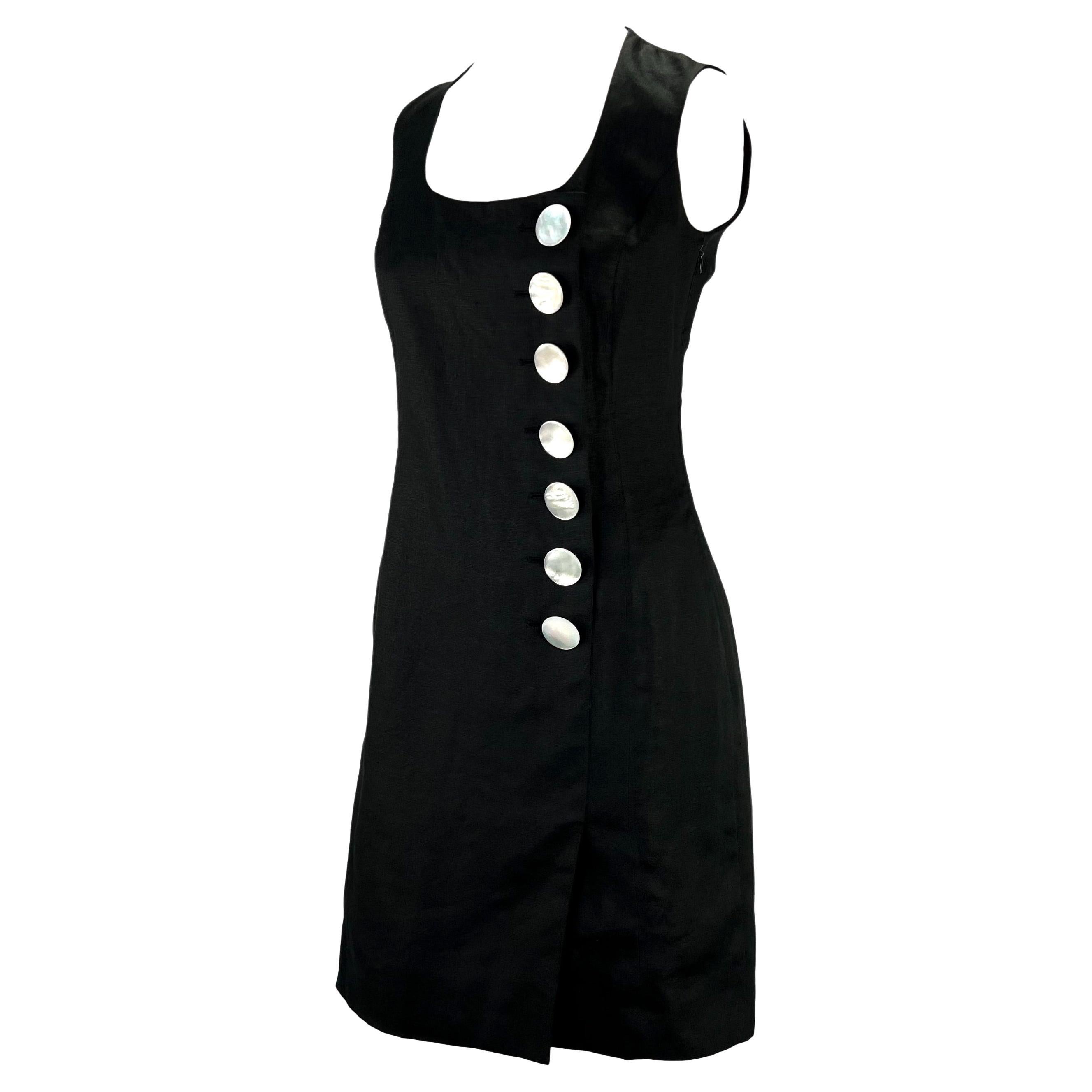 Presenting a black sleeveless linen Christian Dior Boutique dress, designed by Gianfranco Ferré. From the early 1990s, this classically beautiful dress features a wide scoop neckline and large mother of pearl accent buttons on the side. Effortlessly