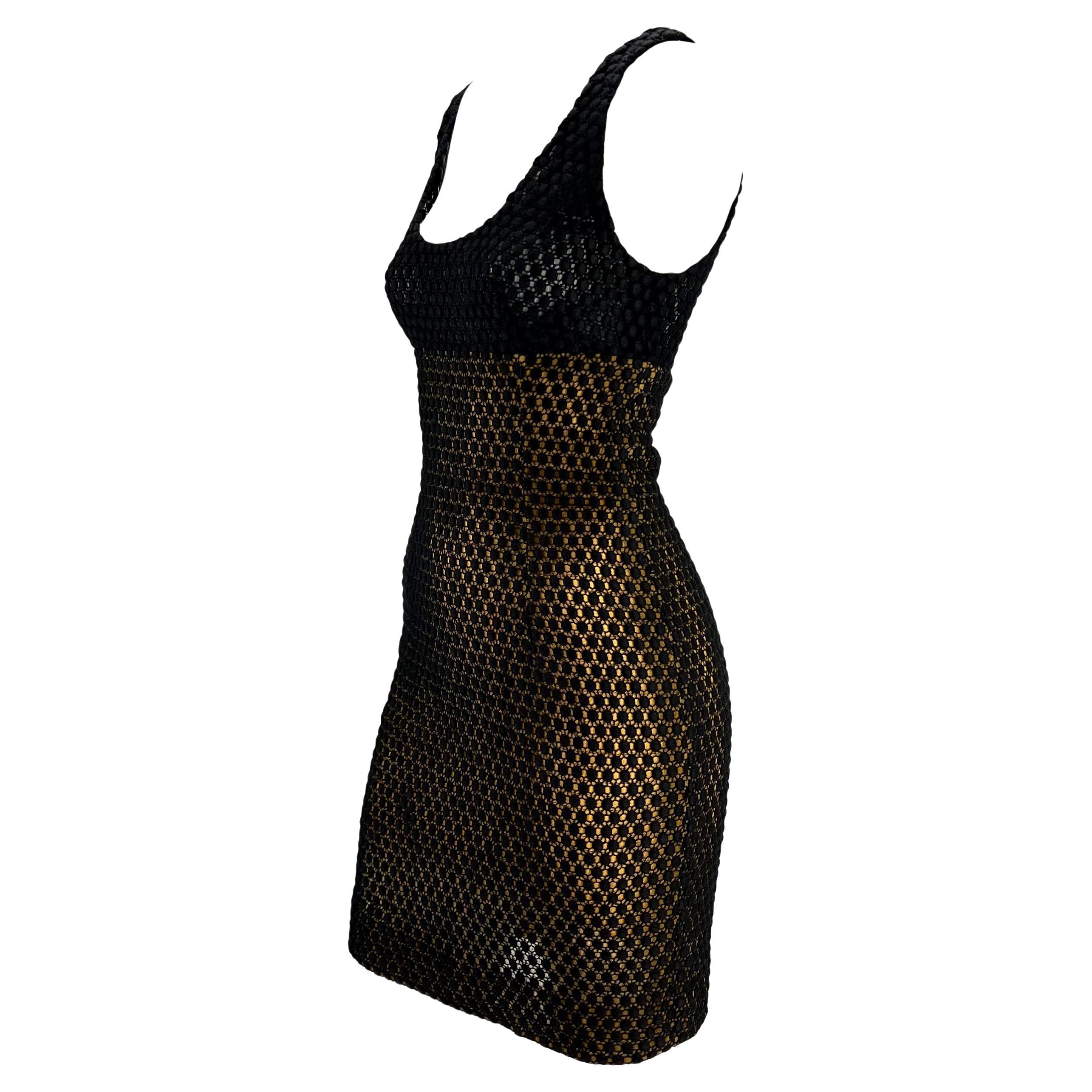 Presenting a sensual yellow and black knit Christian Dior Boutique dress, designed by Gianfranco Ferré. From the 1990s, this beautiful sleeveless dress features a knit polka dot pattern atop a yellow mesh at the body and black mesh at the bust. The