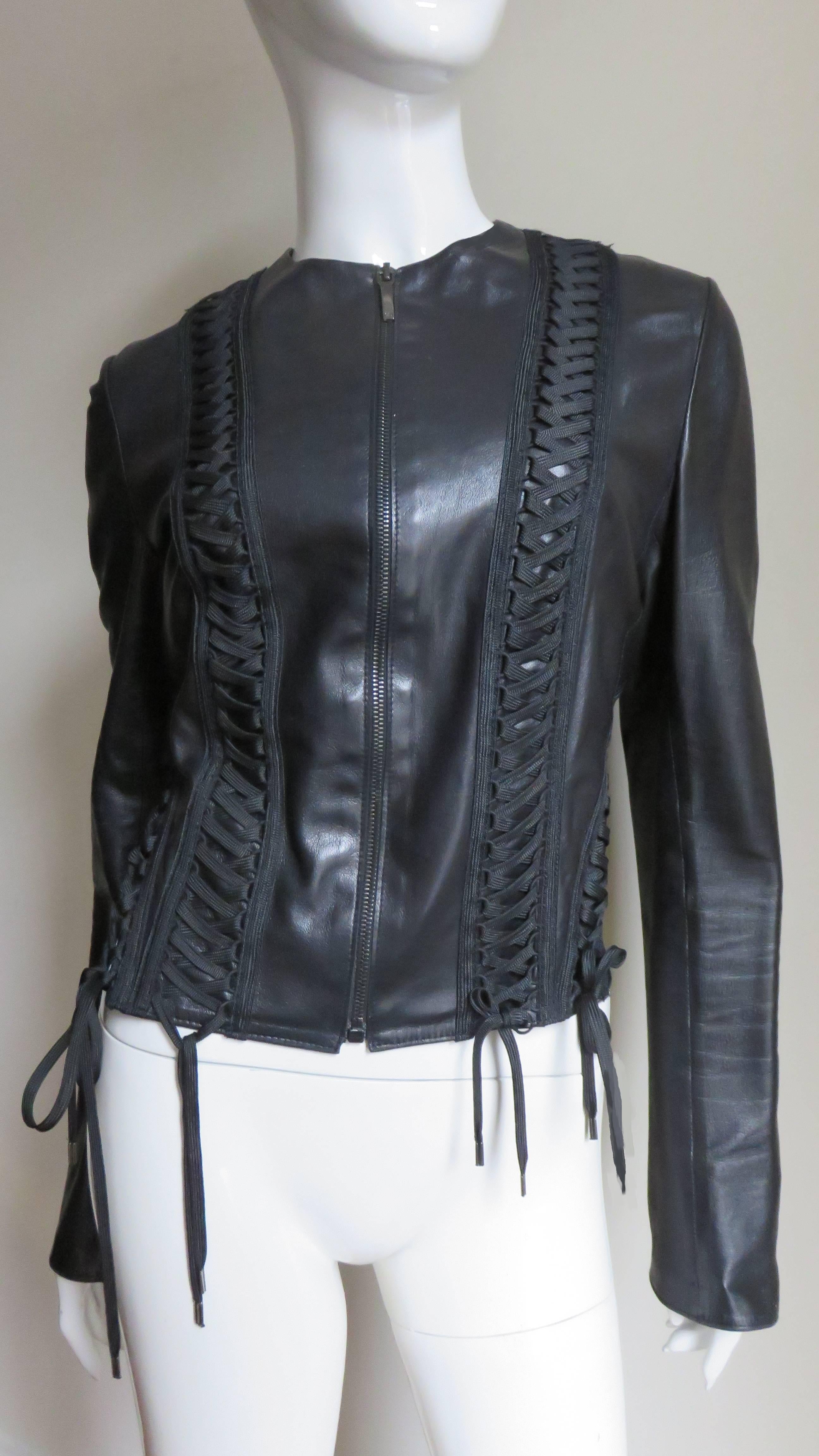 A fabulous soft fine black leather jacket by John Galliano for Christian Dior.  It has elaborate lacing detail along the entire length of the jacket on either side of the center front zipper and 4 rows in the back fanning out from the neckline.