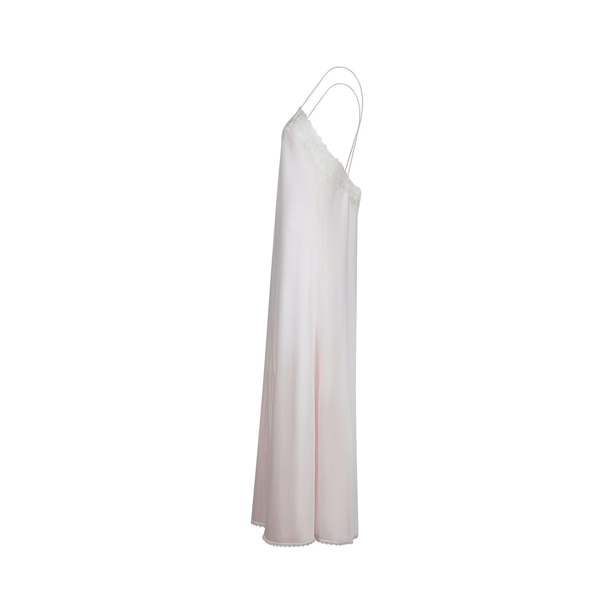 This pretty 1990s slip dress is by Christian Dior. The brand label reads “Christian Dior Lingerie” and it most likely pre-dates John Galliano's tenure as Creative Director. Tailored in the US from man-made matte satin in palest rose pink, it is