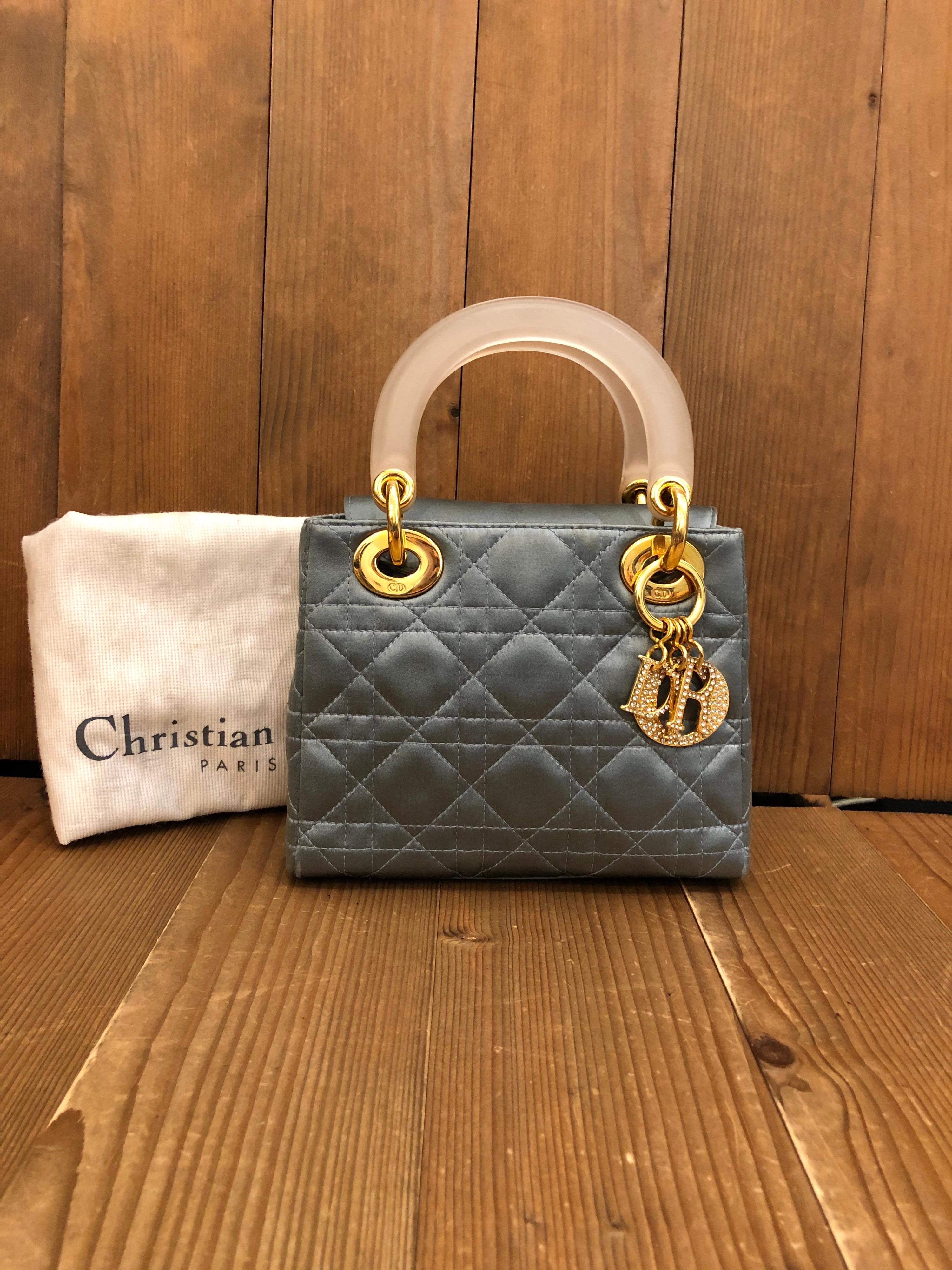 The most iconic Christian Dior handbag, the Lady Dior, in honor of Diana, Princess of Wales. It was the handbag Dior wished to give the Princess of Wales to carry on the occasion of her visit to Paris.

This Mini Lady Dior is decorated with light
