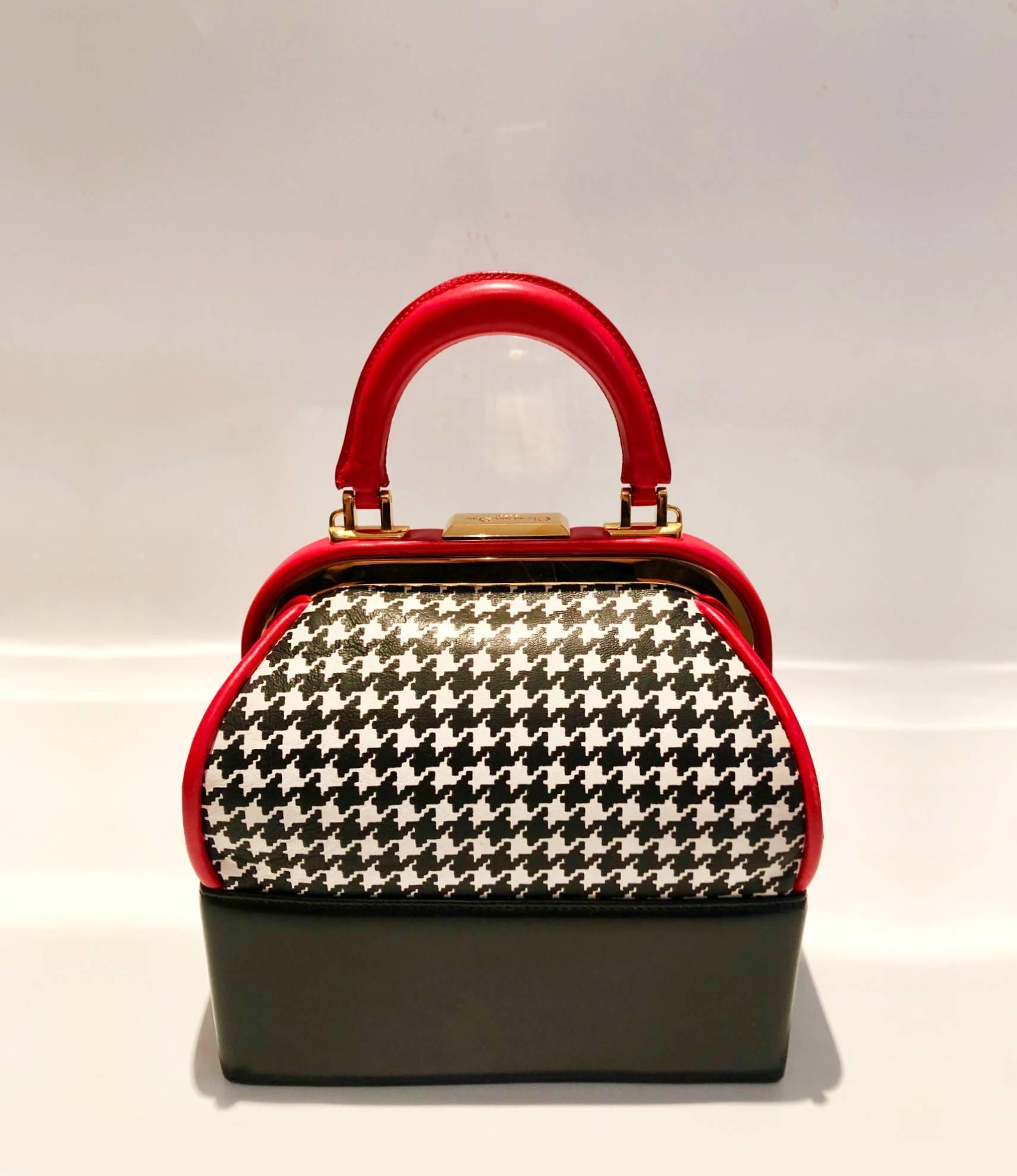 One of a kind Christian Dior Black and White Houndstooth patterned leather handbag with beautiful Red trim and Gold hardware, told handle, top clutch closure, inside zip pocket, red lining
Condition:  excellent vintage, hardly worn, Palm Beach,