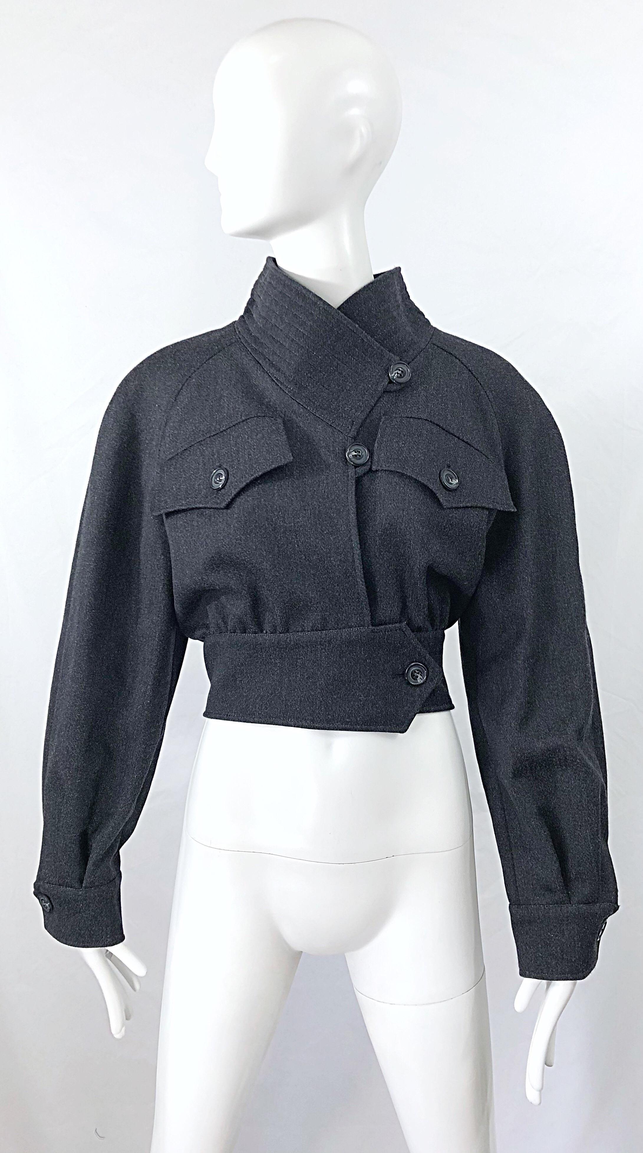 Avant Garde early 1990s CHRISTIAN LACROIX grey cropped wool jacket ! Features dolman sleeves with cargo pockets at each breast. Button at side waist and two up the center bodice. Button at each sleeve cuff. Fully lined. Can easily be dressed up or