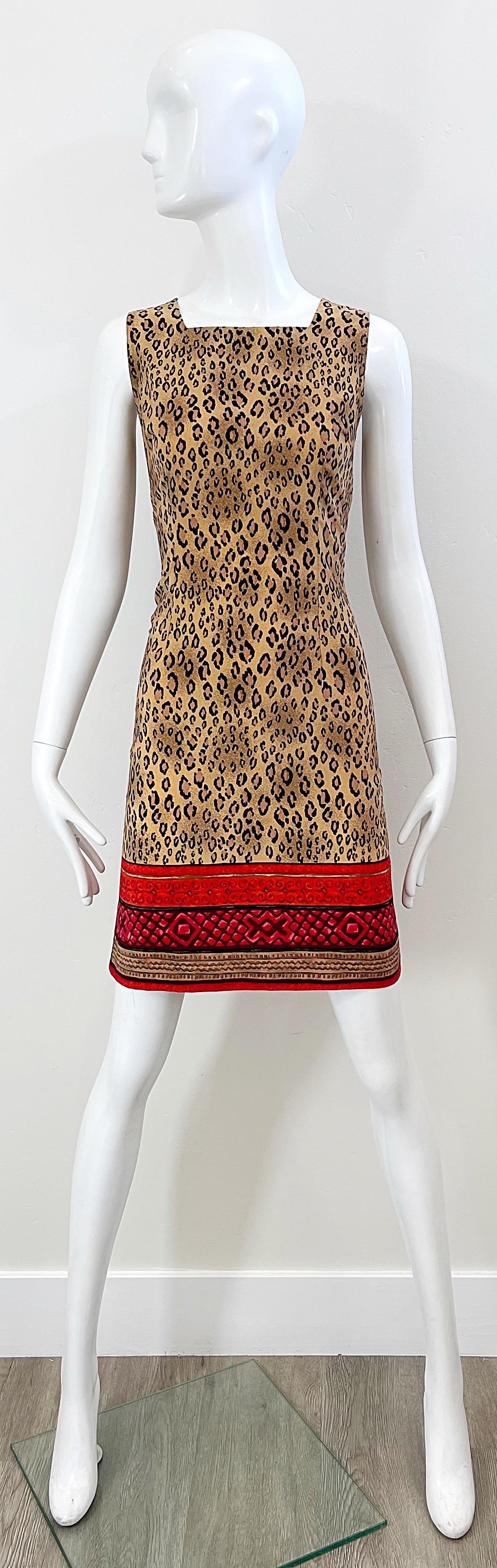 Chic 90s CHRISTIAN LACROIX leopard animal print rayon dress ! Features tribal print at hem in red, pink and brown. Hidden zipper up the back with hook-and-eye closure. Great belted or alone for any day or evening event. 
In great unworn