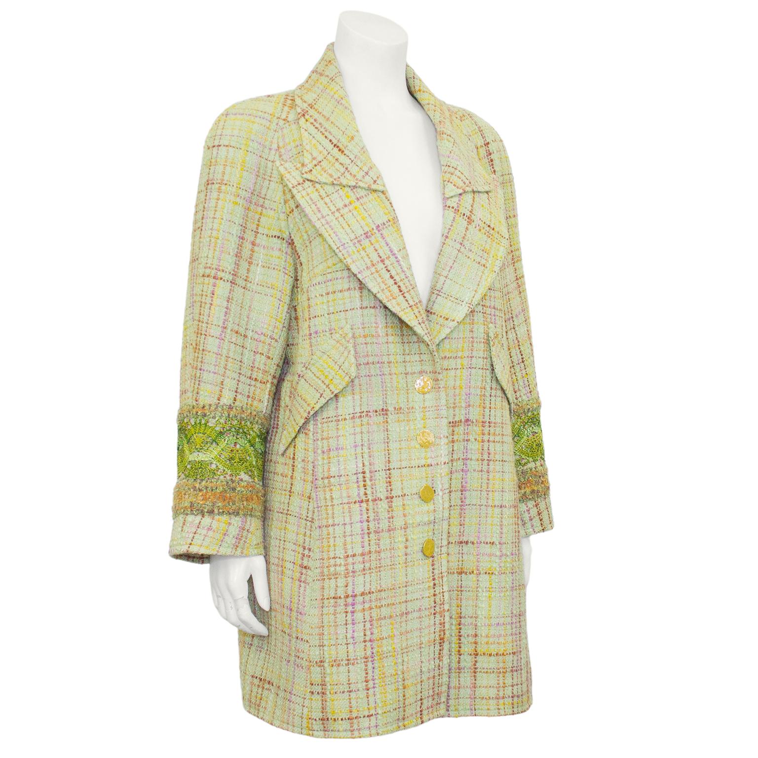 Christian Lacroix ensemble from the 1990s. Long equestrian style pastel green tweed with shades of pink, purple and yellow throughout. Oversized notched collar, crochet detail at cuffs, faux diagonal flap pockets and functional hidden vertical slit
