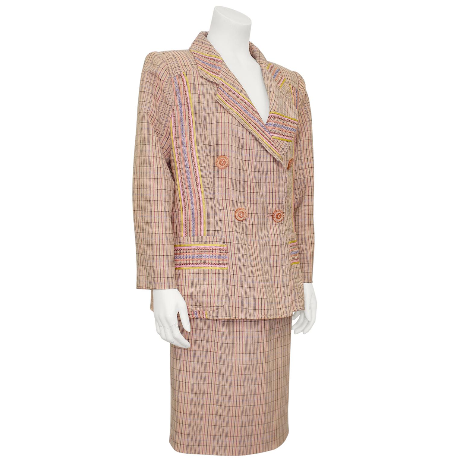 1990s Christian Lacroix peach striped skirt suit with cross stitch embellishments on the lapels, front and pockets as well as across the back of the shoulders. The peach striped fabric is accented with gold, periwinkle, pink and plum trimmings which