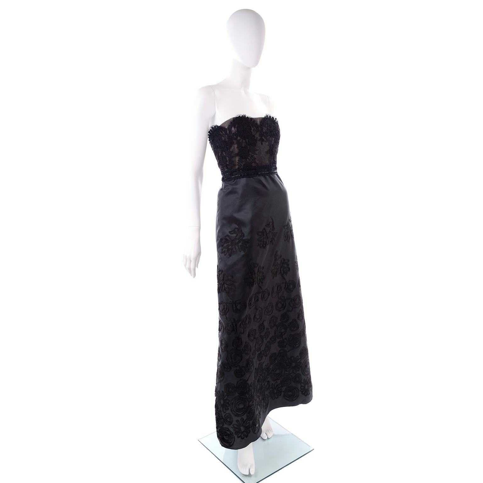 This vintage dress was designed by Christian Lacroix in 1999.  This black satin dress is strapless and has beautiful lace overlays and a lace waistband.  The dress closes with Metal zipper down the back center seam and a hook-and-eye. The dress is