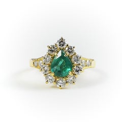 1990s Classic Engagement and Statement Emerald 18 Karat Gold Ring with Diamonds