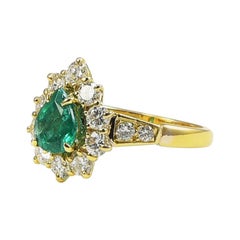 Vintage 1990s Classic Engagement and Statement Emerald 18 Karat Gold Ring with Diamonds