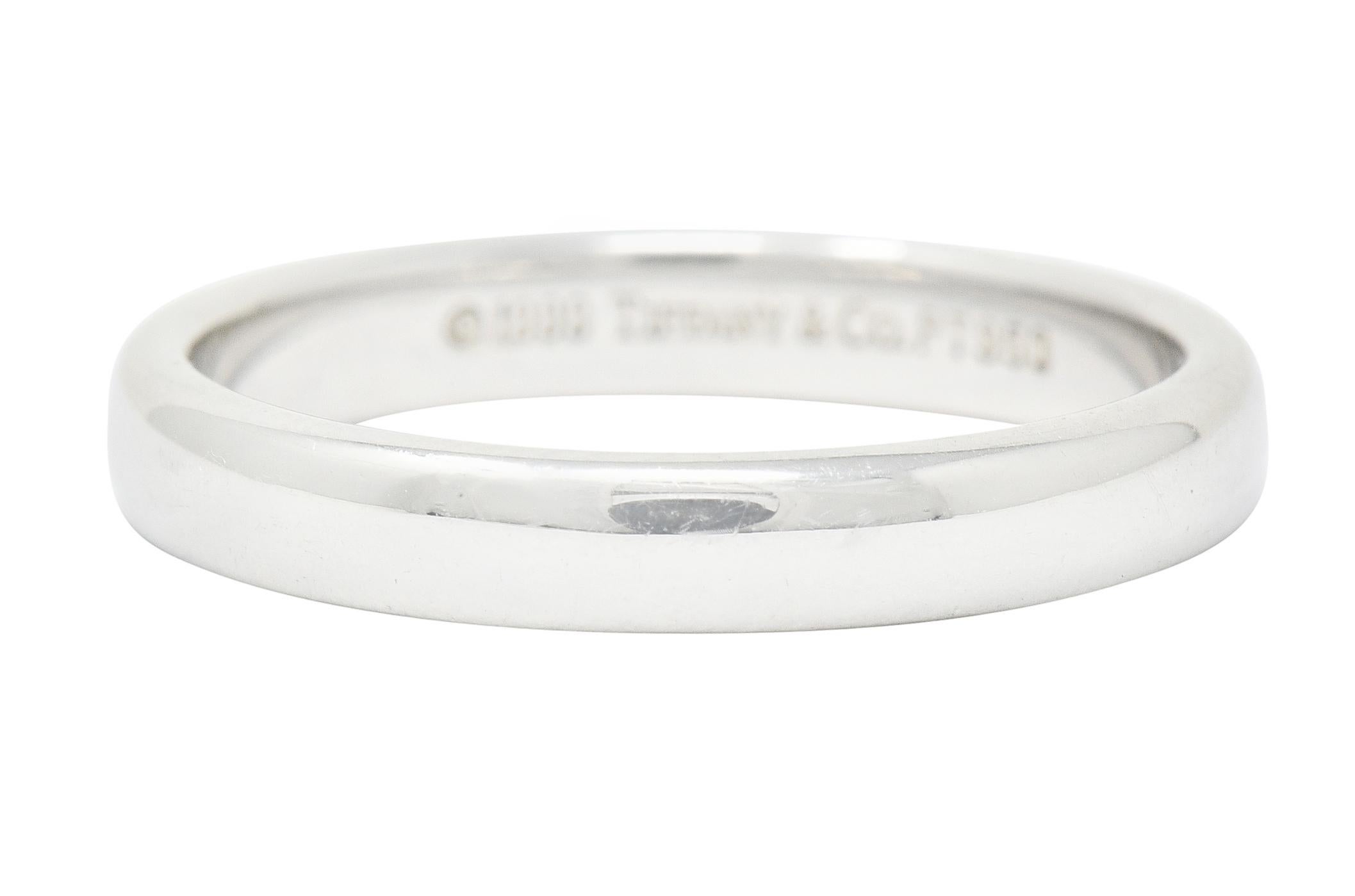 Band style ring designed with a very slight domed curvature and rounded edges for a comfort fit

Completed by a high polish

Fully signed 1990 Tiffany & Co.

Stamped PT950 for platinum

Ring Size: 5 1/2 & sizable

Measures: 3.1 mm wide and sits 1.5