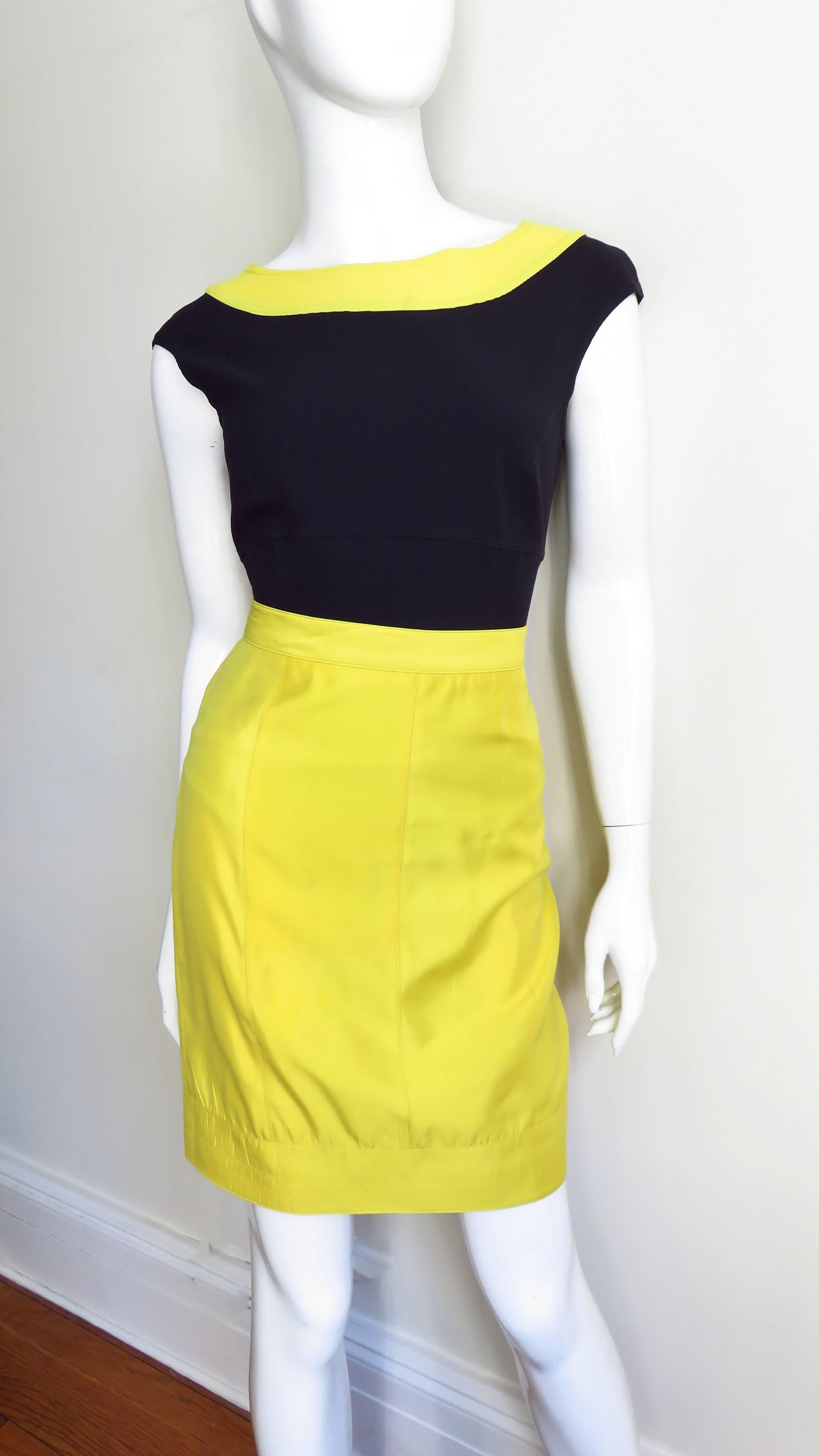 A fabulous silk/cotton blend set from Claude Montana in yellow and black. The 3 piece set consists of a yellow pencil skirt, a full black button front mid calf length skirt and a yellow trimmed black jersey sleeveless bodysuit with a bateau