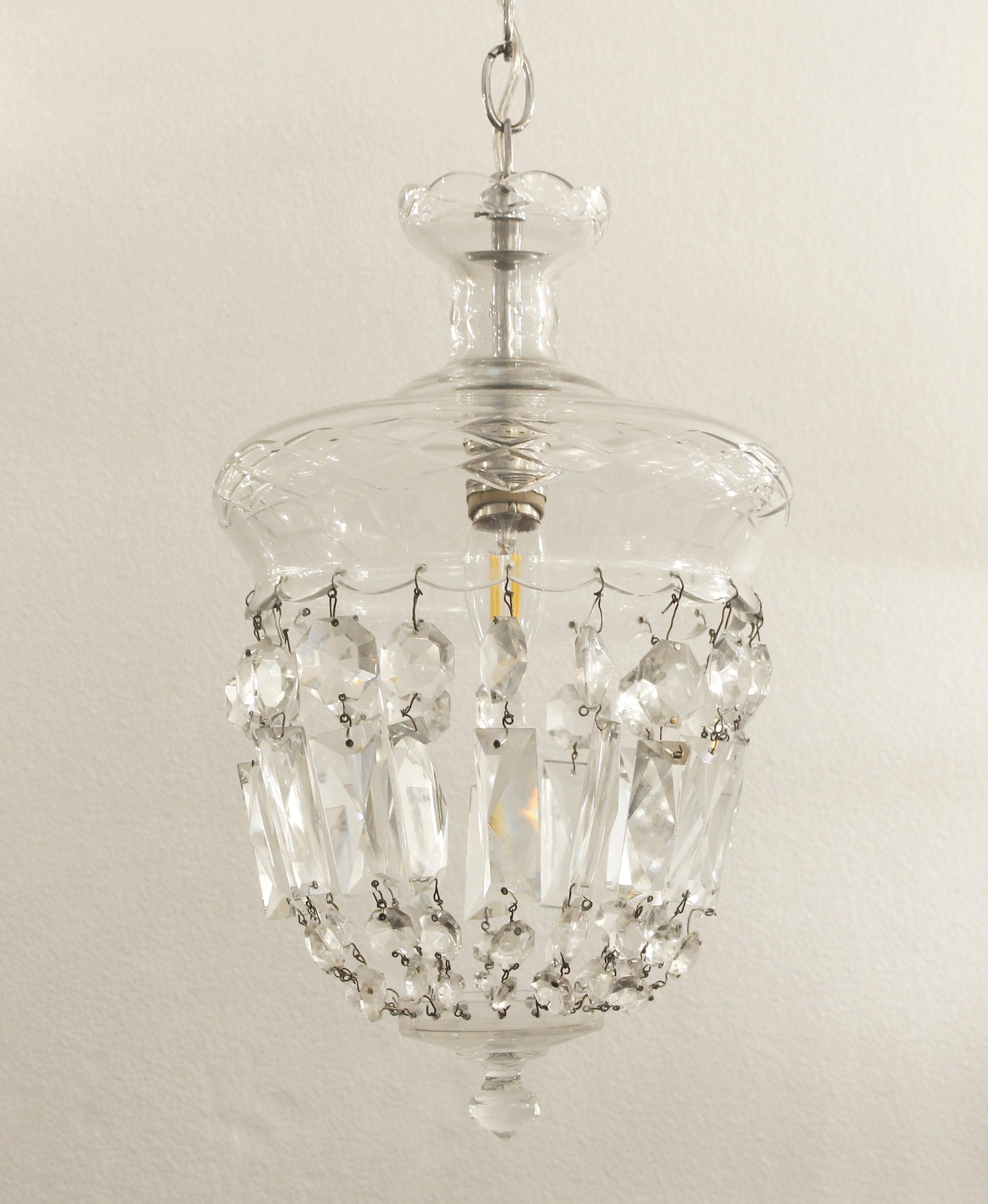 1990s clear glass pendant light with a chrome fitter and single socket. Done in a bell jar style. This can be seen at our 302 Bowery location in Manhattan.