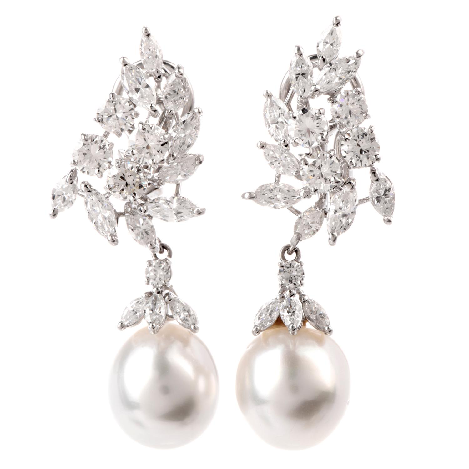 These stunning Diamond and Pearl Dangle earrings were inspired in a Leaf design and crafted in 18.4 grams of Platinum.

Adorning the earrings are multiple round and marquise shaped diamonds in a leaf pattern weighing approximately 7.30 carats and