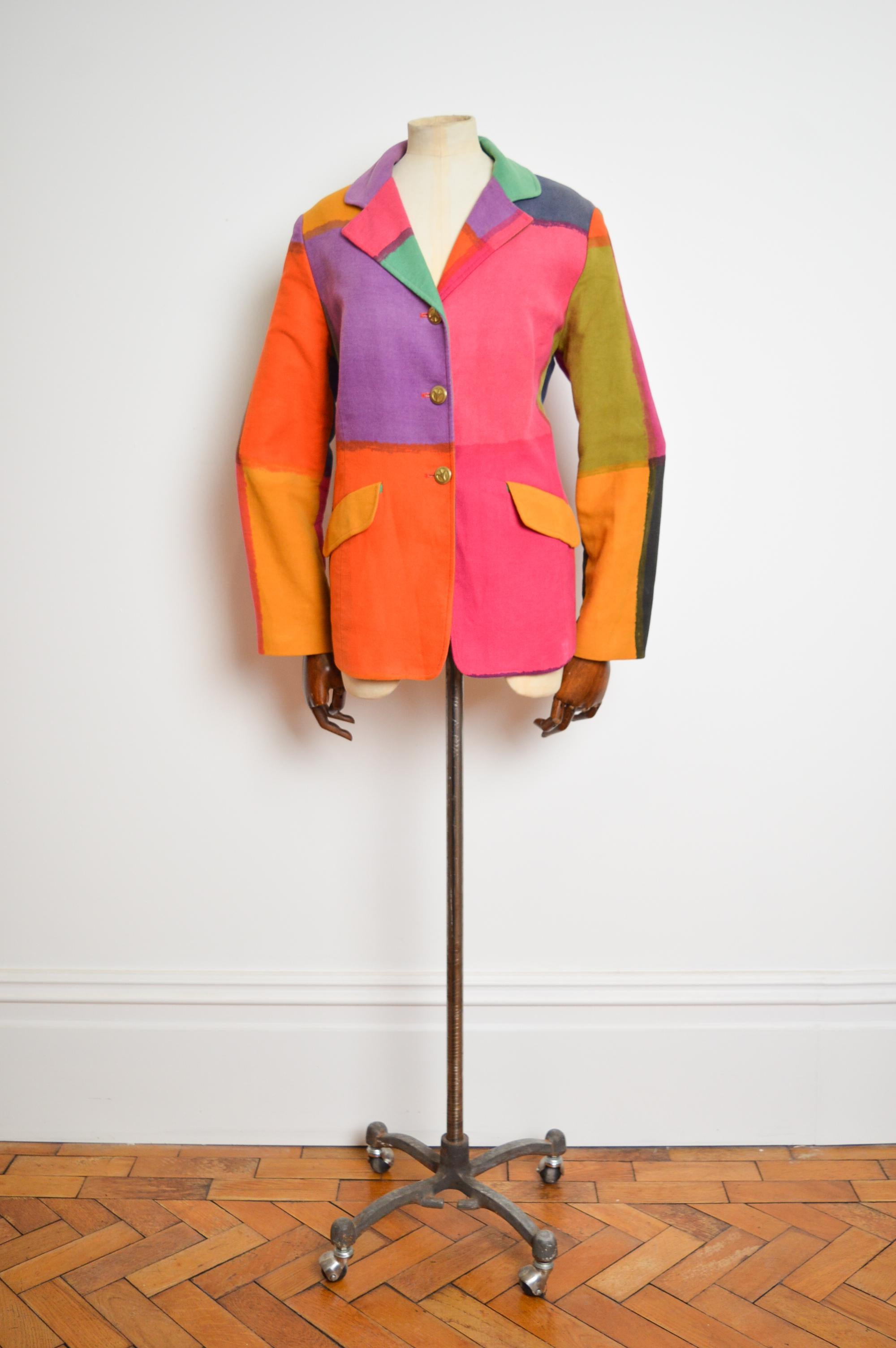 A Superb, fun early nineties Franco Moschino colourful blazer jacket from the iconic 'Cheap & Chic' line !  

MADE IN ITALY.

Features; Peace shaped Buttons down the front, Vibrant Orange satin lining, brushed cotton texture, Hip pockets, Belt