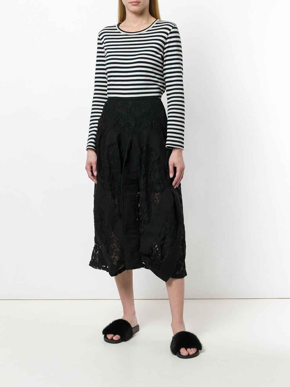 A.N.G.E.L.O. VINTAGE - Italy

Junya Watanabe Comme Des Garçons black lace skirt with high waist, black cotton fabric inserts, back hook and zip closure, medium length, draped design, lace panels and distressed finish.

Years: 90s

Size: M

Made in