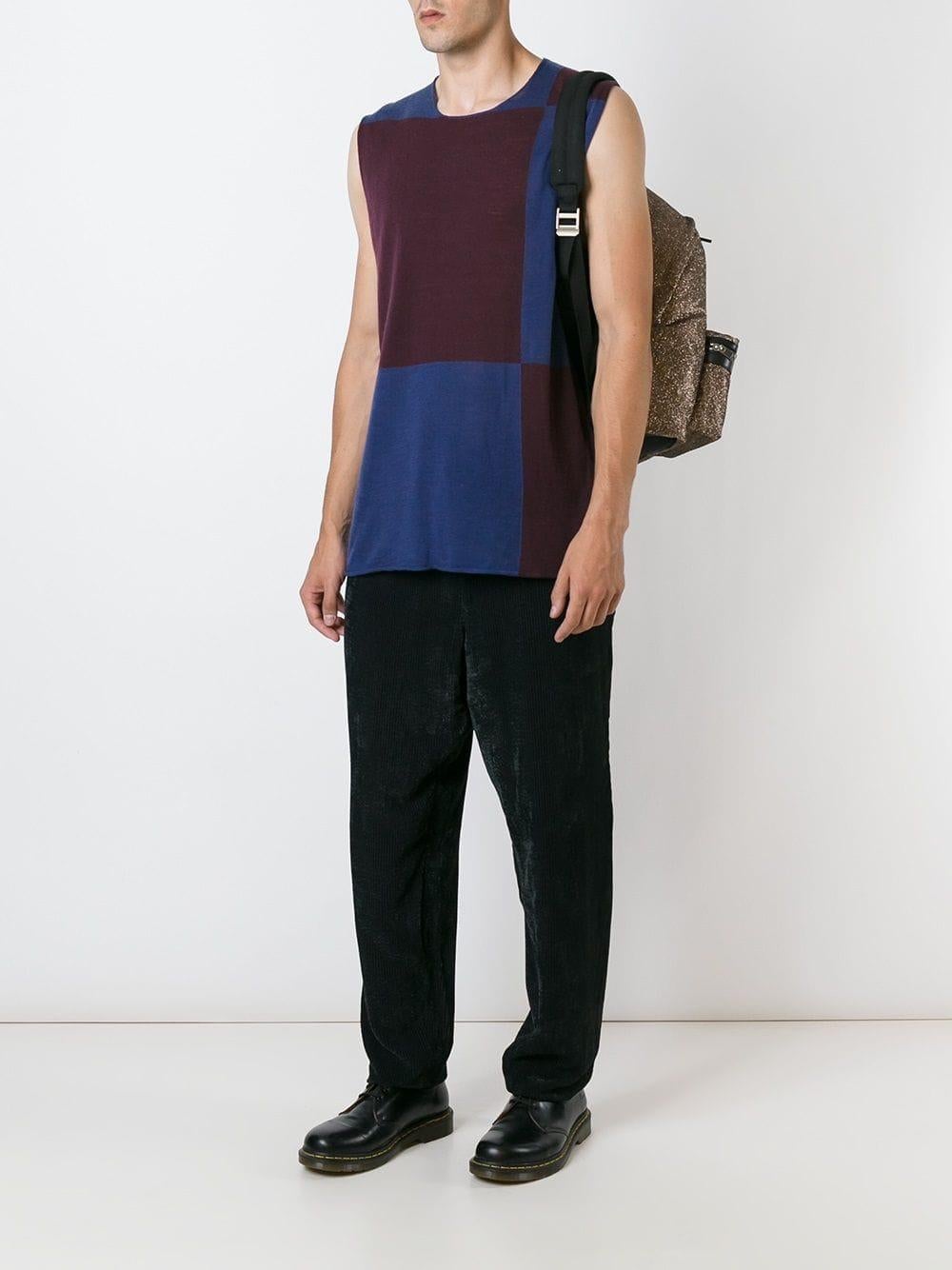Comme Des Garçons wool blend top with colour block in purple and blue, straight cut, round neckline, sleeveless.

Years: 1990s

Made in Japan

Size: L

Linear measures 
Height: 75 cm
Bust: 53 cm