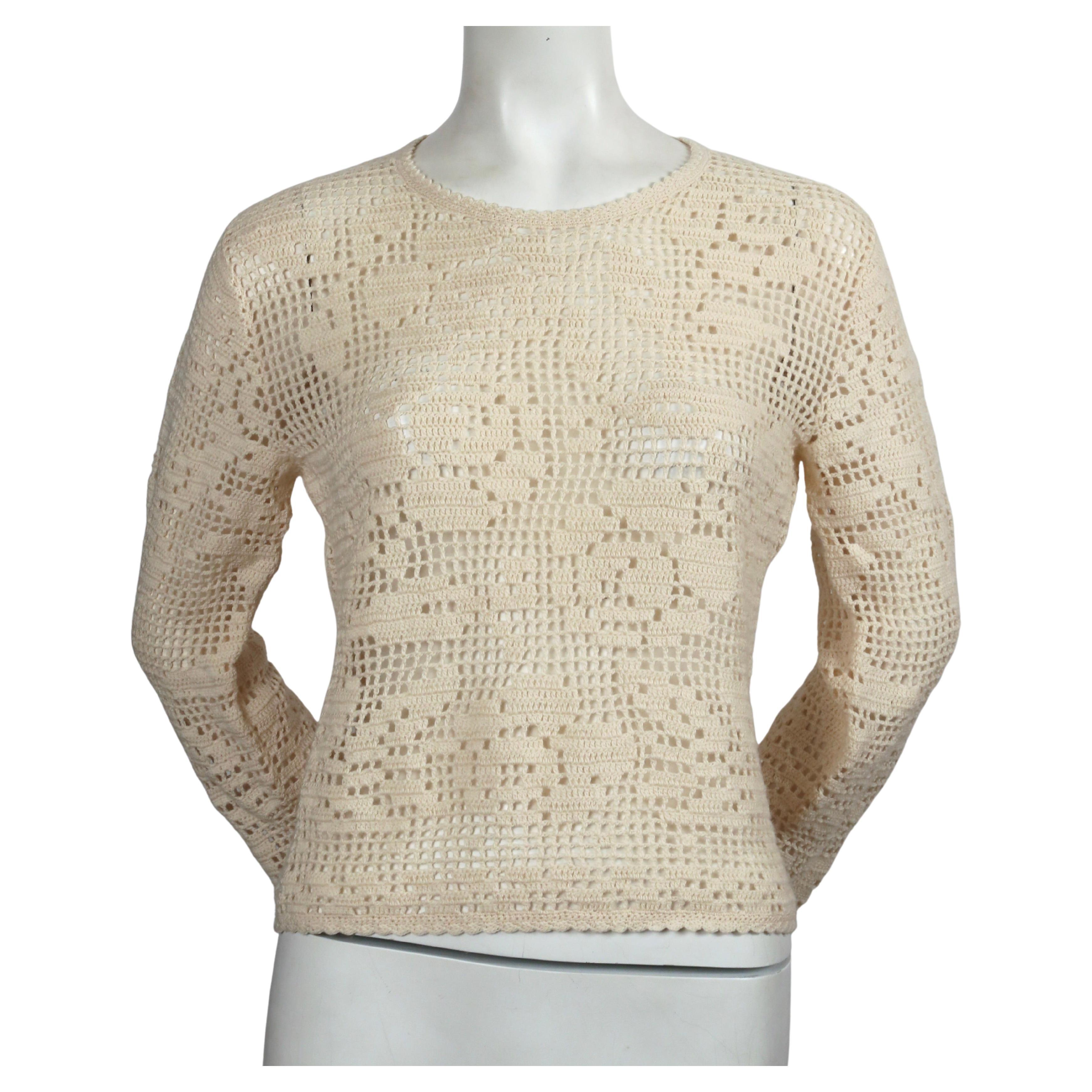 Cream crocheted style sweater designed by Rei Kawakubo for Comme Des Garcons dating to the late 1990's or early 2000's. Labeled a size M however it best fits an XS or S.  Approximate measurements (unstretched): shoulder 15.75