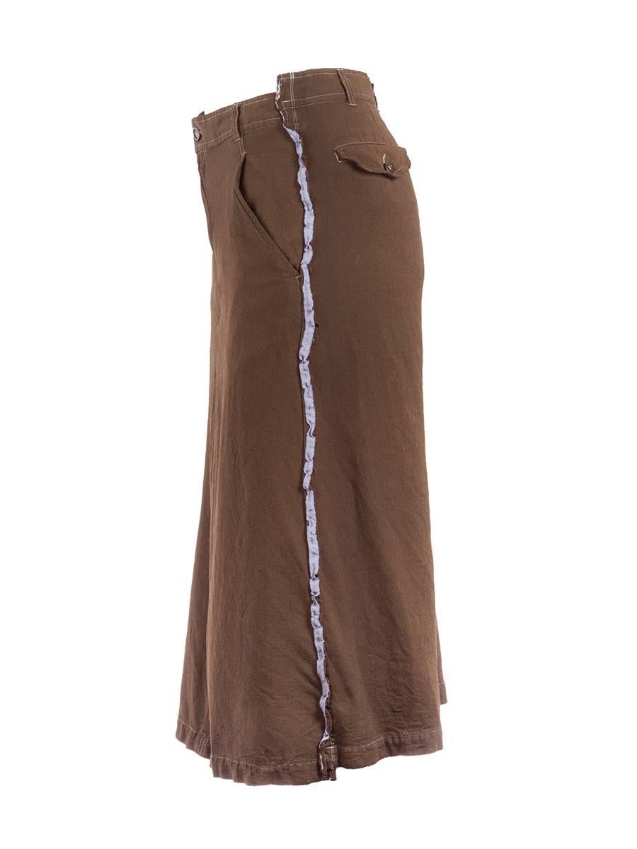 1990's Comme des Garçons washed wool khaki pencil skirt with lavender silk ruffled side strips and a zip and button closure. New with Tags.