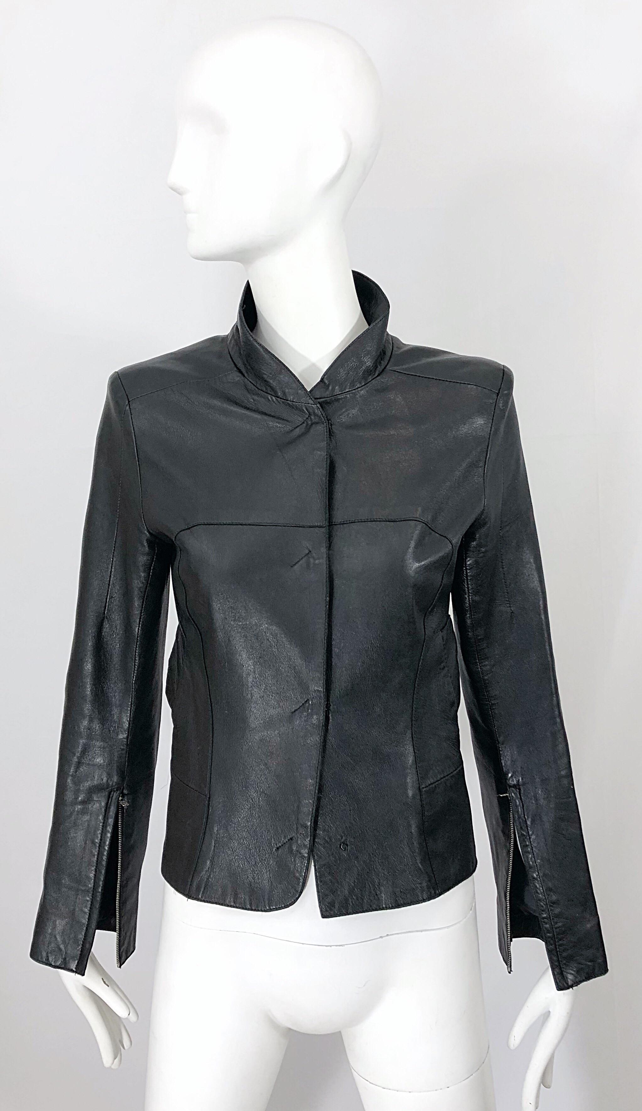 Sleek and chic late 90s CoSTUME NATIONAL black leather zipper sleeves moto jacket! The perfect everyday leather jacket. This tailored beauty is the perfect weight for any time of year. Features four hook-and-eye closures up the front. Pockets at