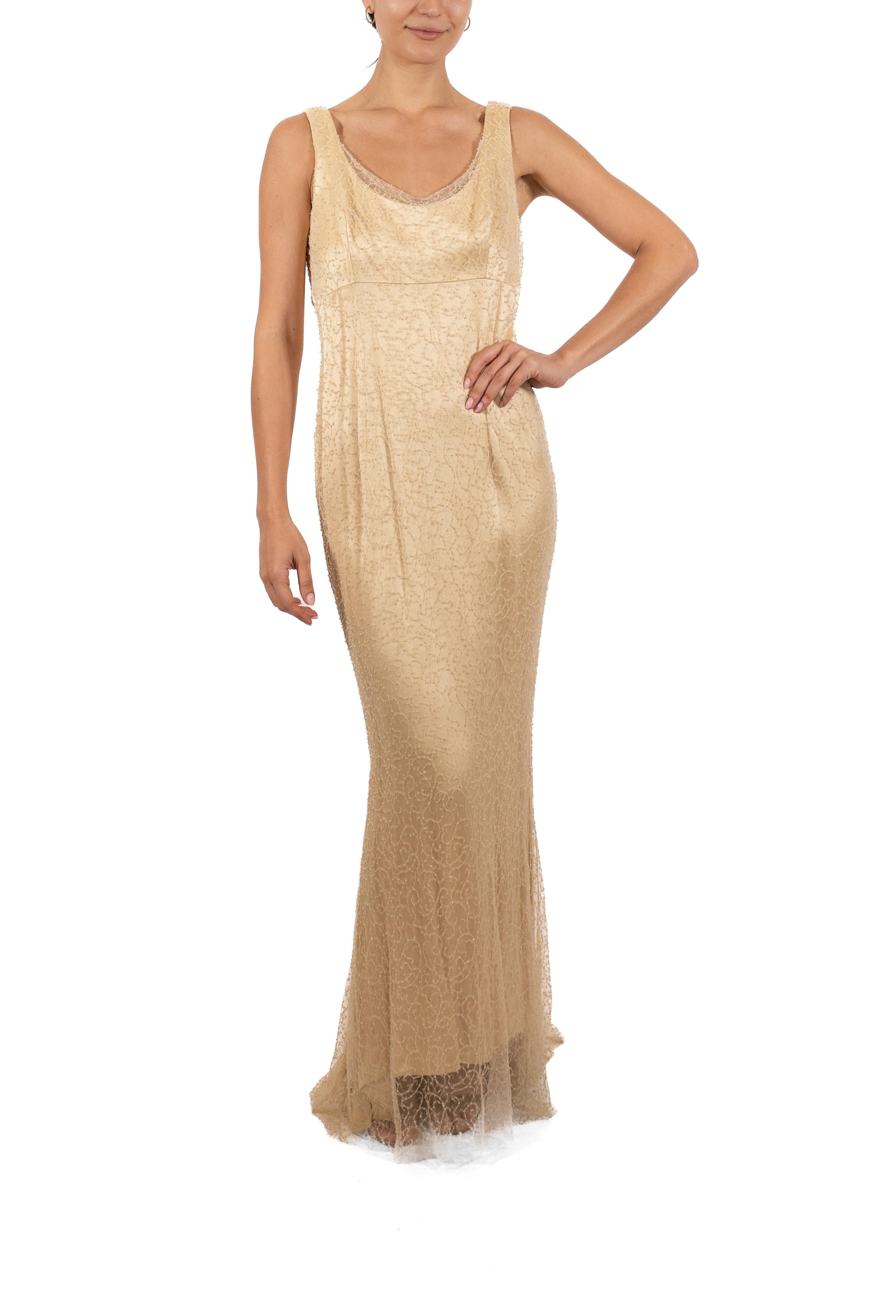This gown retains no label, however the amount of hand-finishing points to Haute Couture or custom made quality, fully lined in silk. 1990S Cream Beaded Silk & Lace Minimalist Empire Waist Gown 