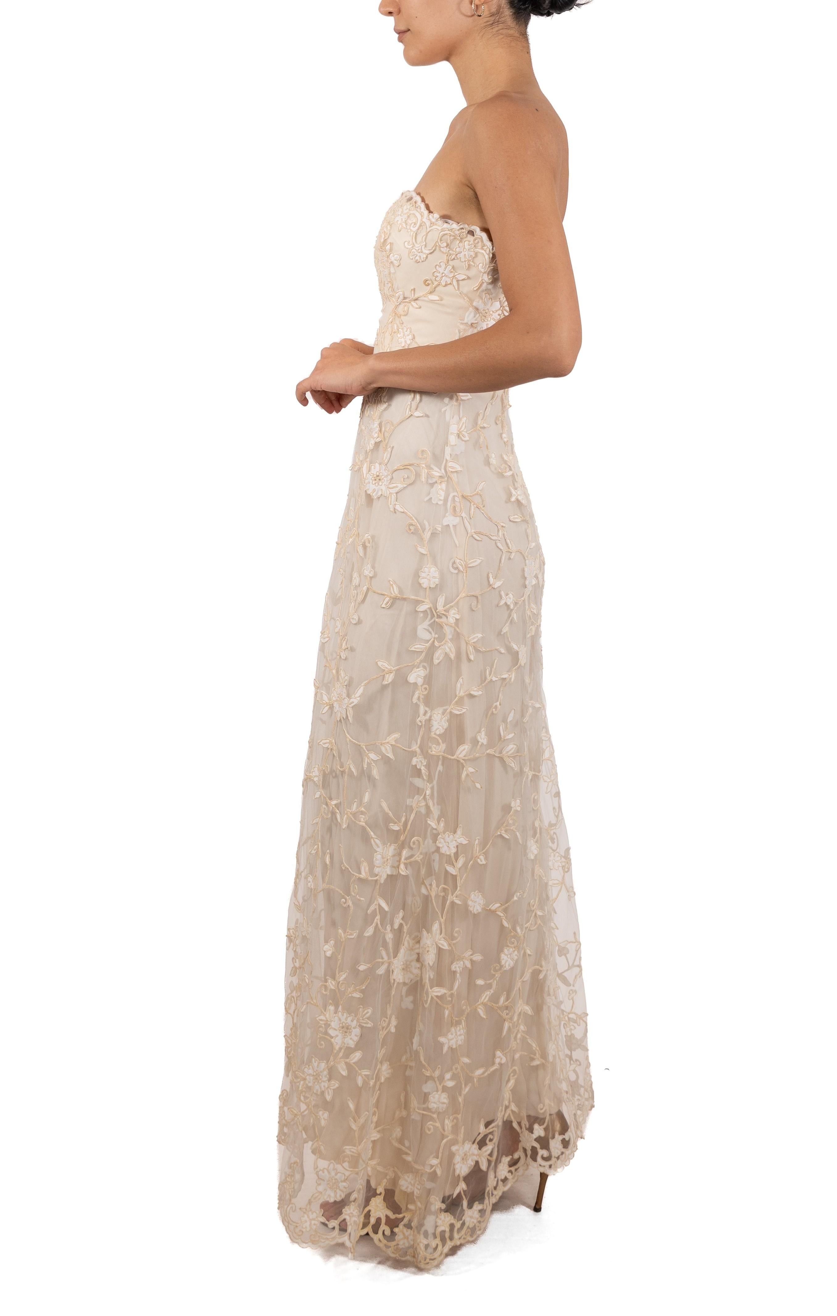 This gown retains no label, however the amount of hand-finishing points to Haute Couture or custom made quality, fully lined in silk. 1990S Cream Silk & Rayon Floral Embroidered Tulle Strapless Gown 