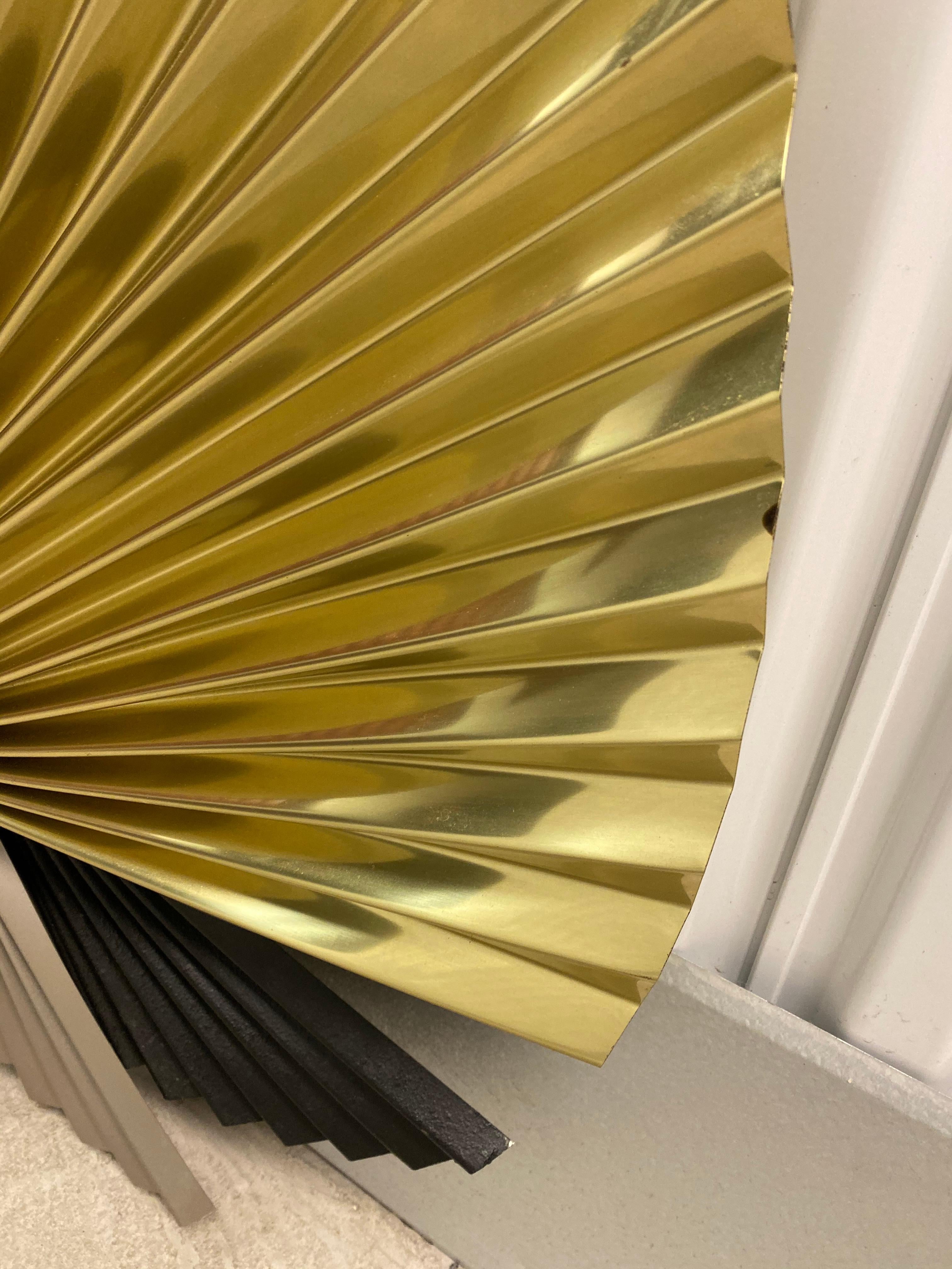 Signed and dated Curtis Jere pleated fan wall sculpture. Great condition with minimal wear and tear on metal. Excellent folded paper look to fan pieces. Can be oriented in different positions on the wall. Brass , gunmetal and powder-coated pleated