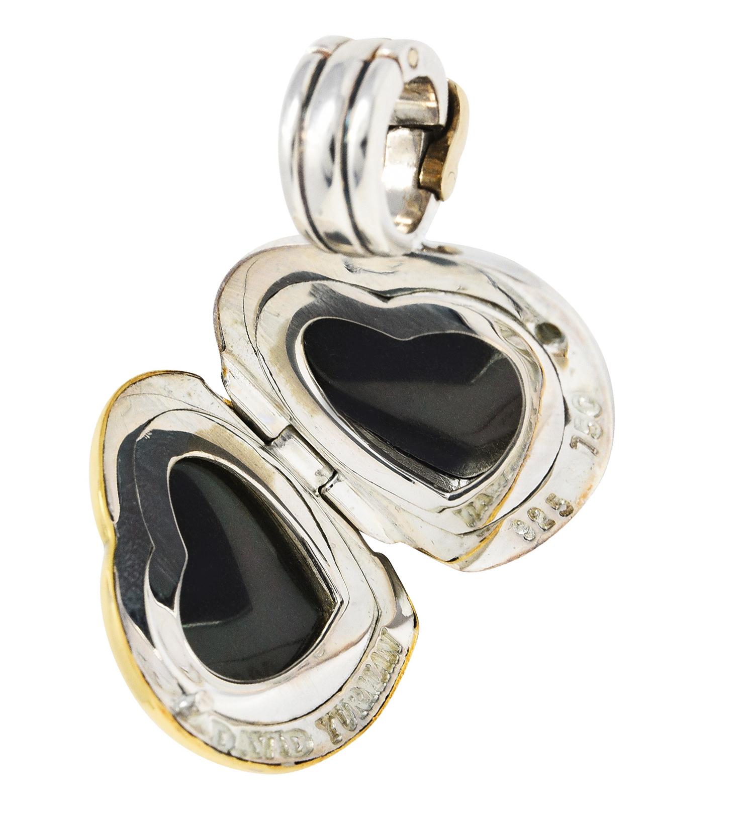 Designed as a highly polished locket centering silver cable motif with gold surround

Opens on a hinge to reveal two heart shaped recesses with plastic covers

Completed by hinged bale with locking mechanism

Stamped 750 and 925 for 18 karat gold