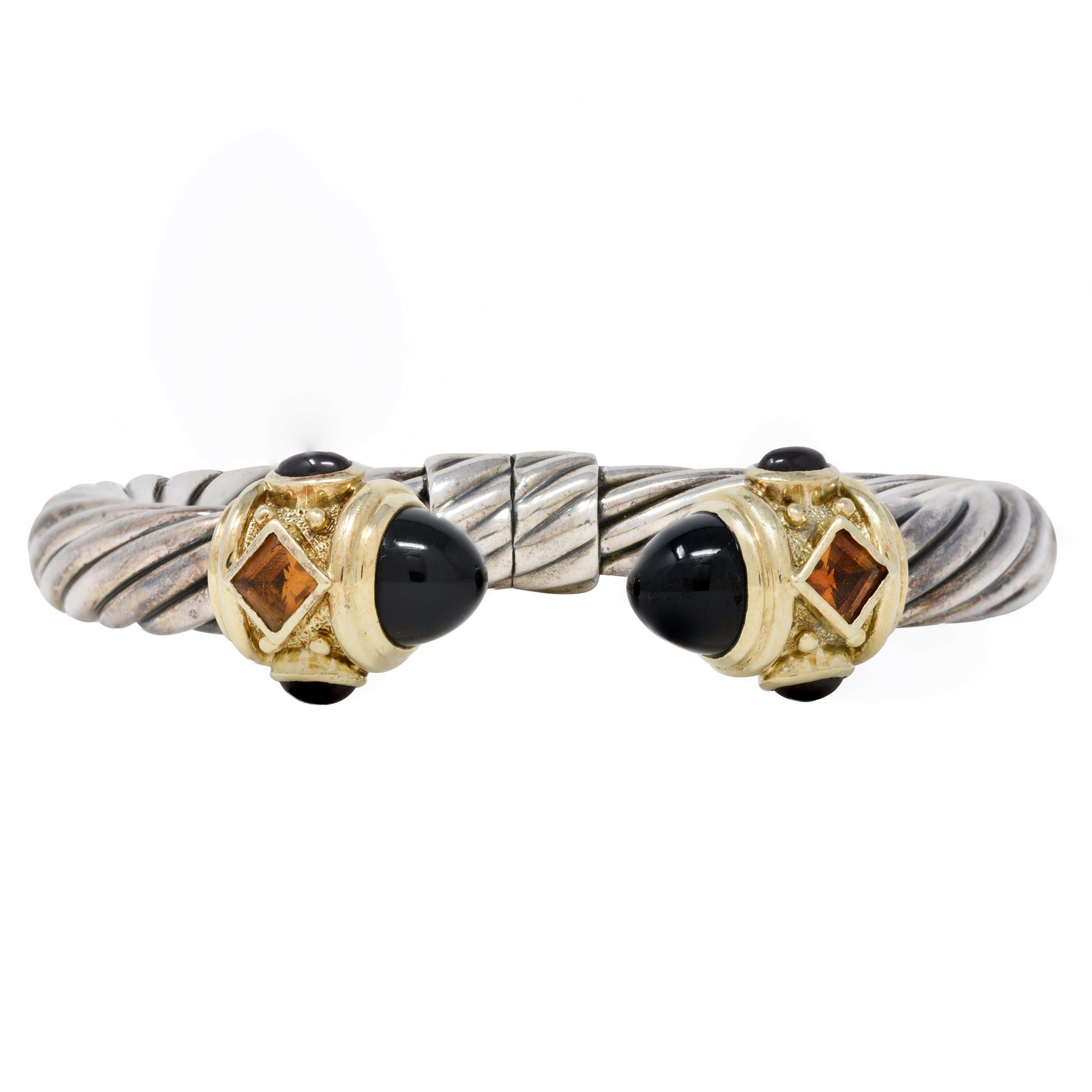 Open cuff is comprised of deeply grooved twist motif silver cable with yellow gold terminals 
Deeply ridged and completed by 9.5 mm round amethyst cabochons - dark purple in color
Accented by oval shaped tourmaline cabochons measuring 3.5 x 5.5 mm