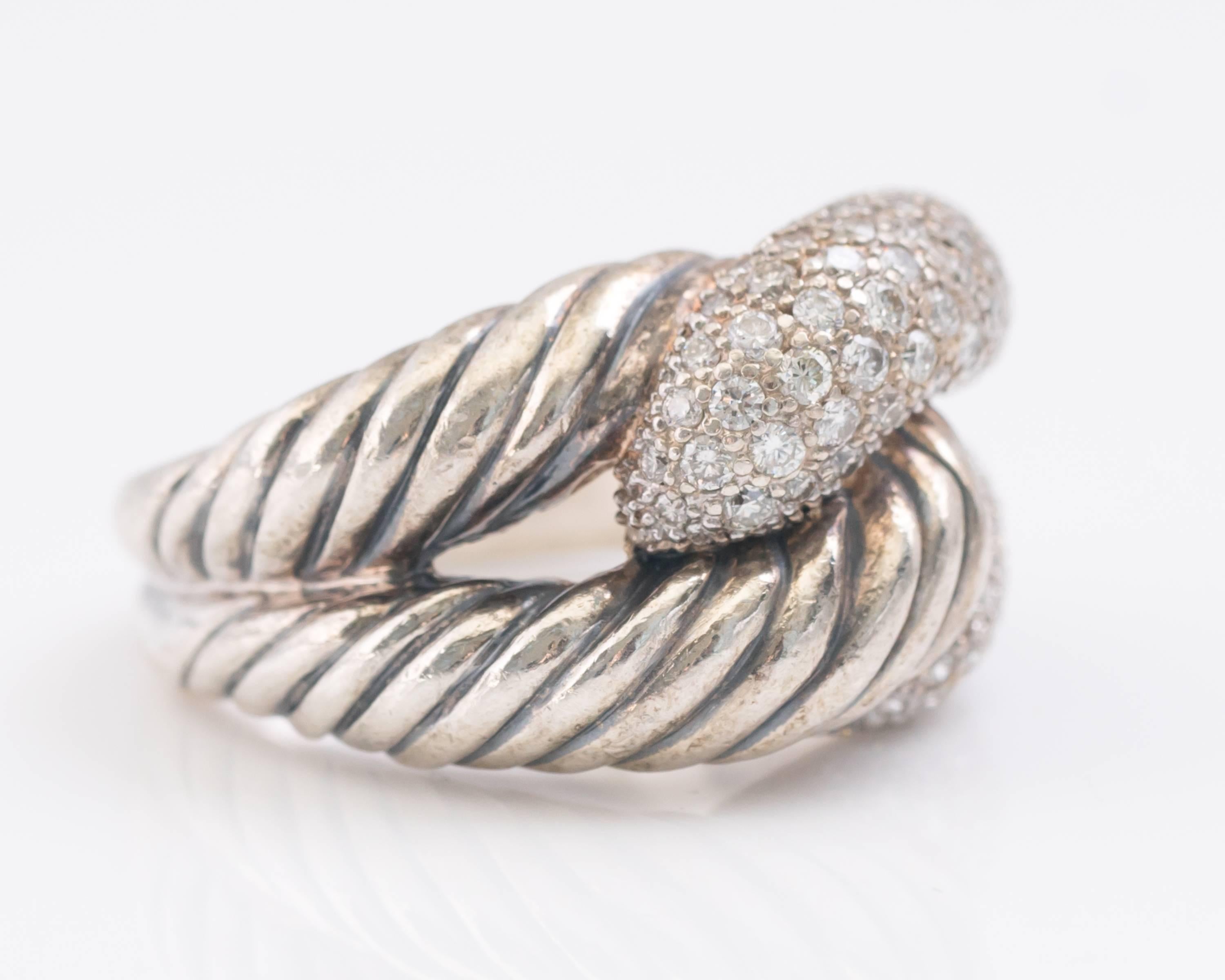 1990s David Yurman Labyrinth Single Loop Ring - Sterling Silver, 1.10 carat total weight Diamonds

Features interlocking links of classic David Yurman cable and pave diamonds. The back half of the ring is smooth and tapers toward the back. The
