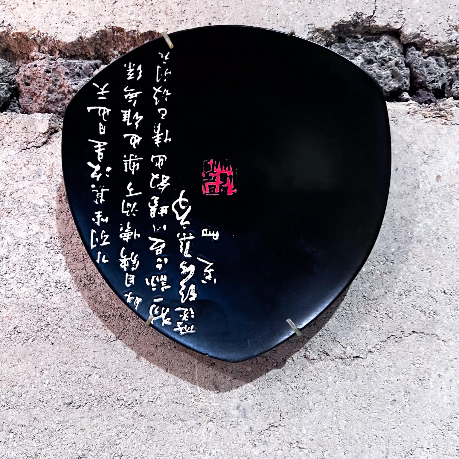 AMBIANIC presents
1990s Decorative Asian Ceramic Black Triangular Plate
1 h x 8 diameter
Preowned original vintage
Refer to images provided.