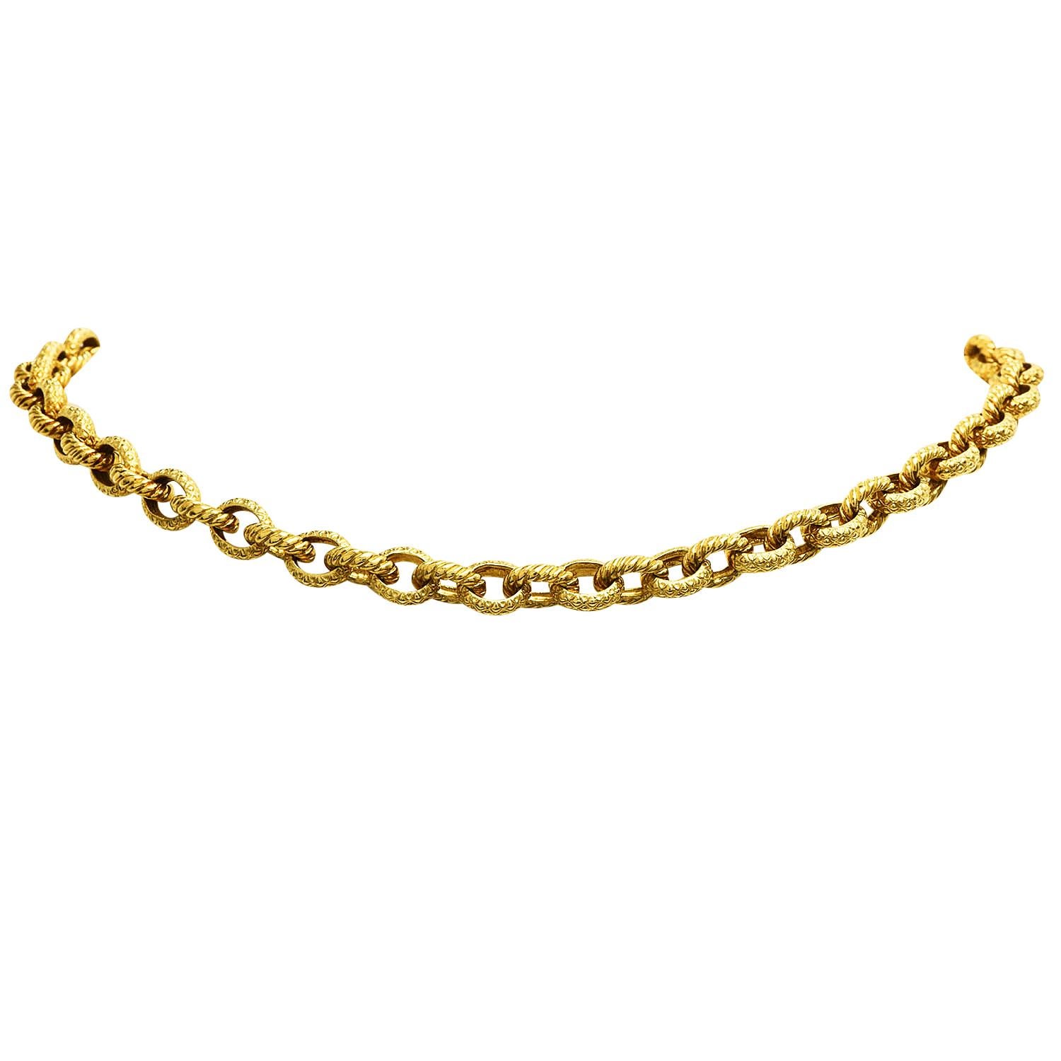 This stylish 1990s Diamond link choker necklace is crafted in 18K  yellow gold.  They feature textured solid gold links with two diamond oval shape links, a heart diamond charm, and a diamond clasp weighing approx. 4.30 carats. this necklace