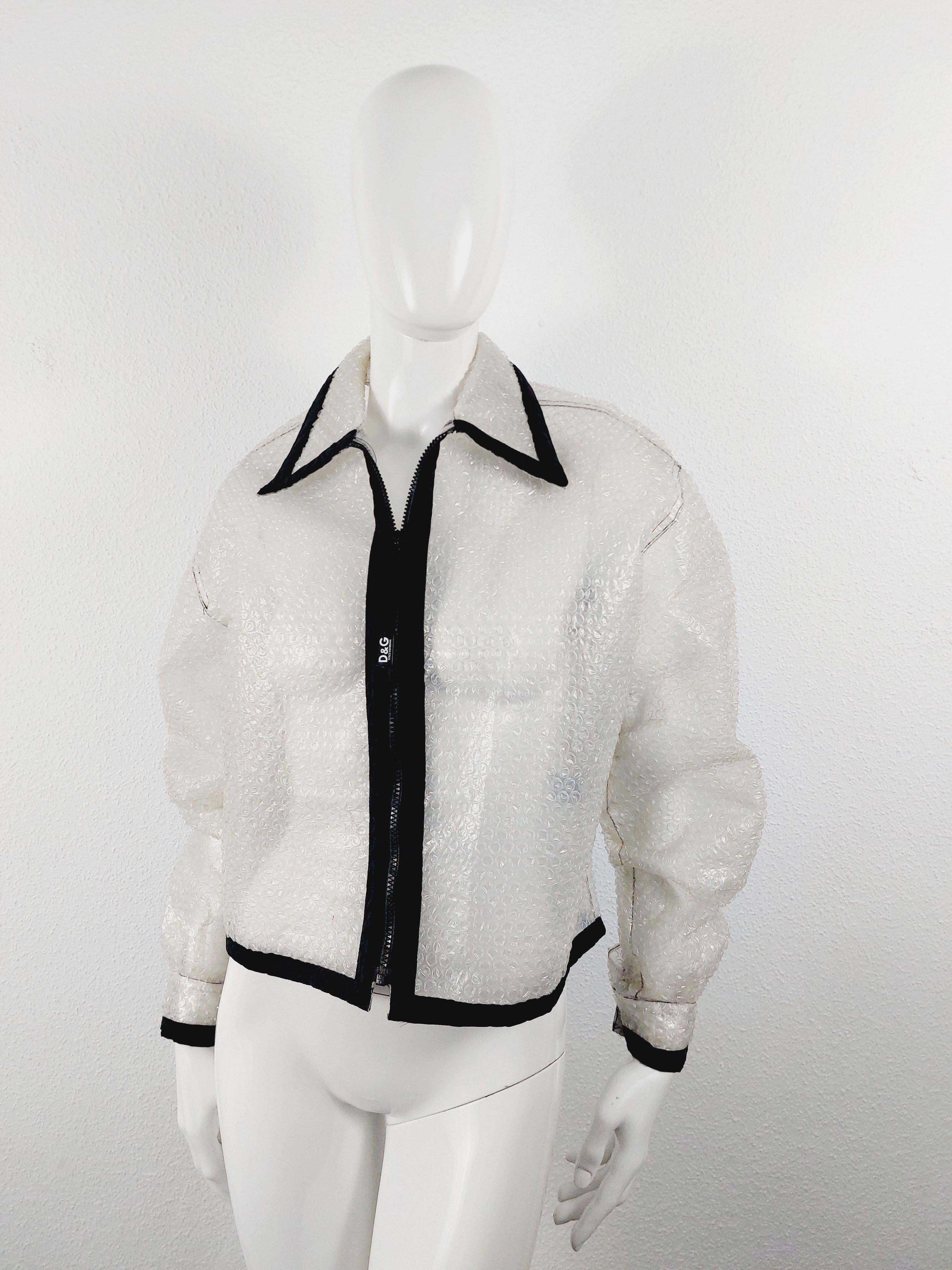 1990's D&G by Dolce & Gabbana Clear Plastic Bubble Wrap Runway Jacket Coat
I’ve never seen anything quite like this. It is a rain jacket that is made out of bubble wrap. The kind that you use for packing goods. The jacket is an IT size 34/48 and has