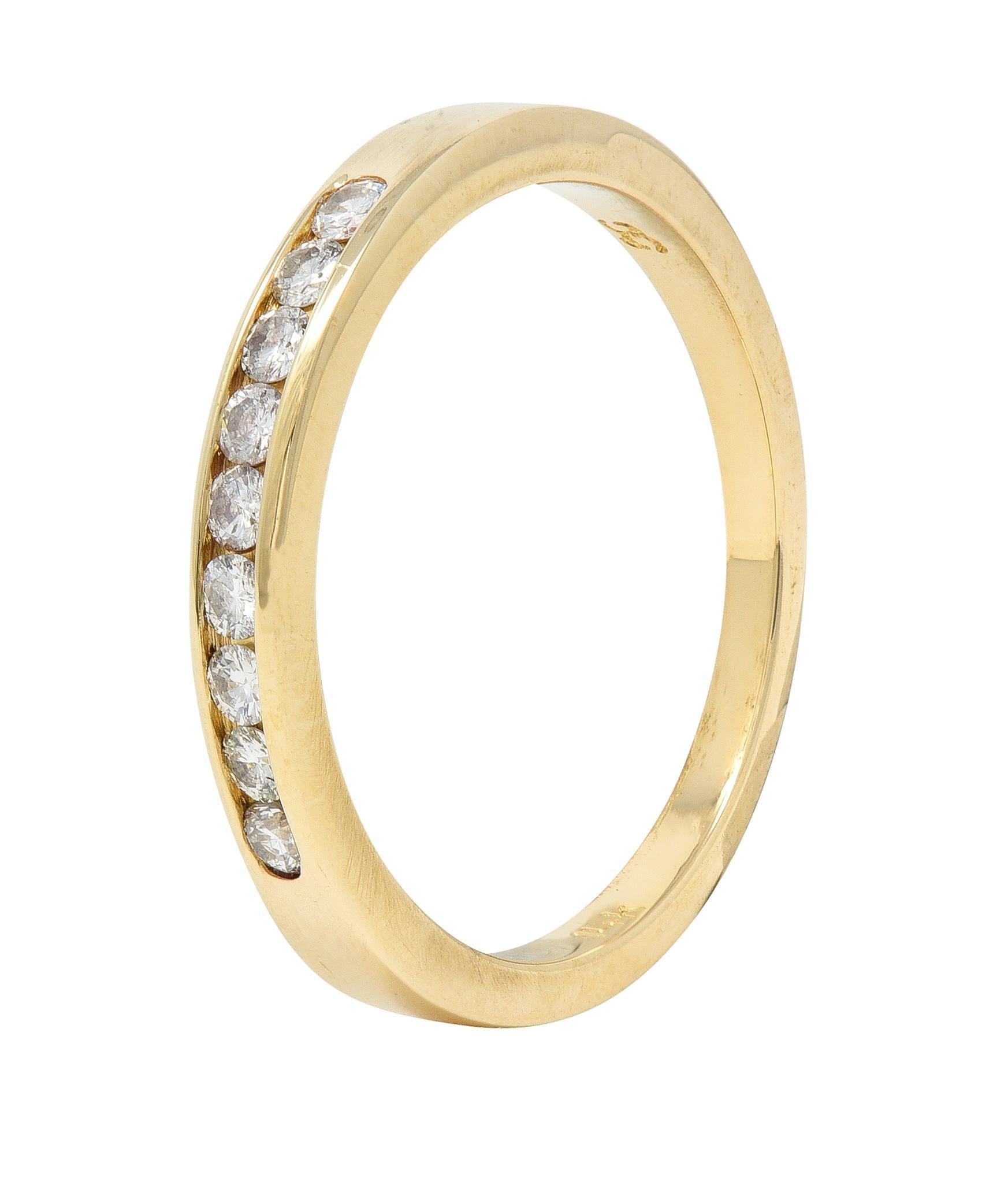 Featuring round brilliant cut diamonds channel set to front 
Weighing approximately 0.27 carat total 
G/H color with VS2 clarity
Completed by high polish finish
Stamped for 14 karat gold
With maker's mark
Circa: 1990s
Ring size: 5 3/4 and sizable