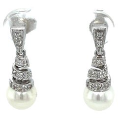 1990s Diamond and Pearl Spiral Drop Earrings in 14 Karat White Gold