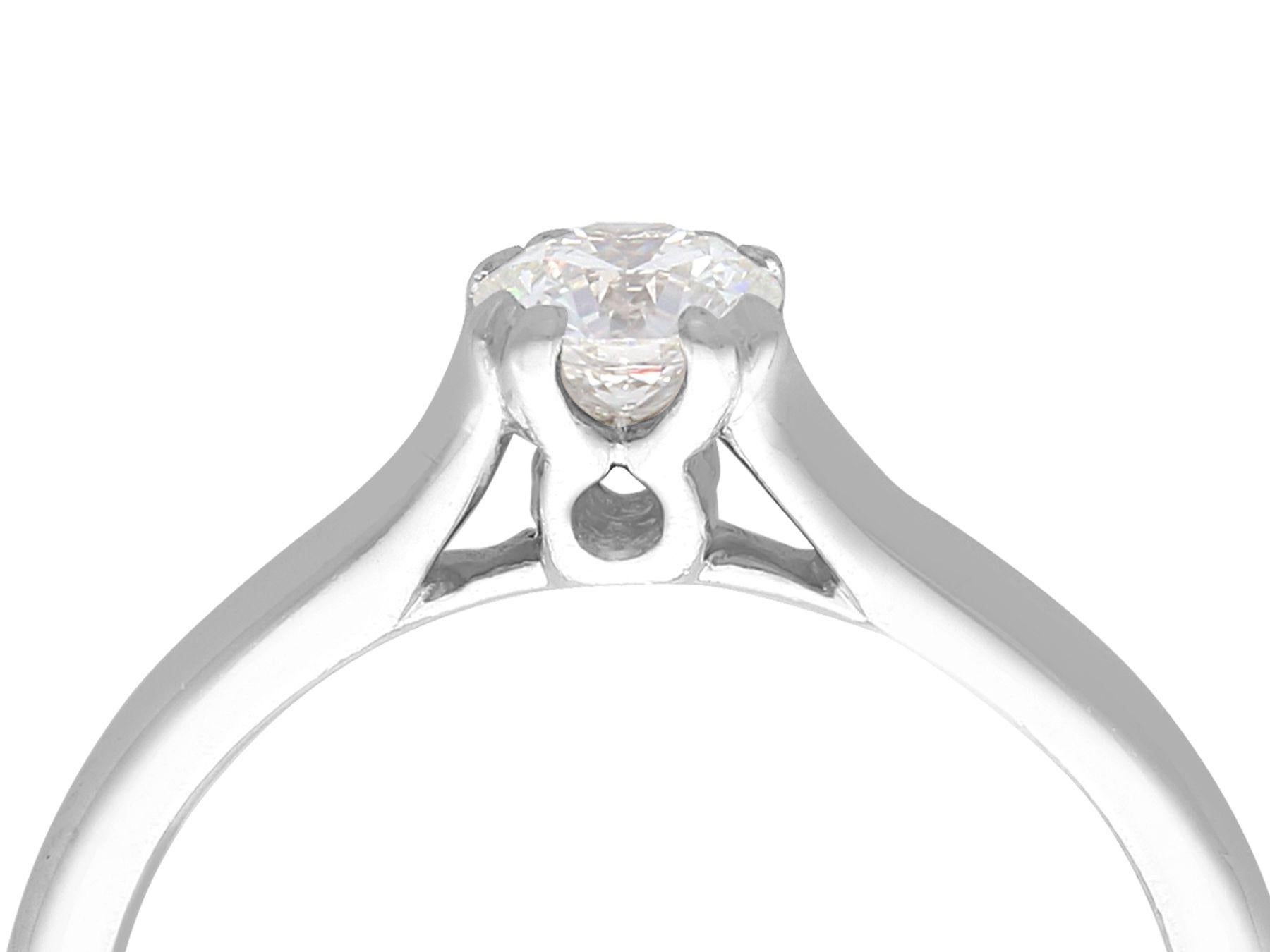 A fine and impressive vintage 0.38 carat diamond and platinum solitaire ring; part of our diamond jewelry/estate jewelry collections.

This impressive diamond solitaire ring has been crafted in platinum.

The vintage 0.38Ct modern brilliant round