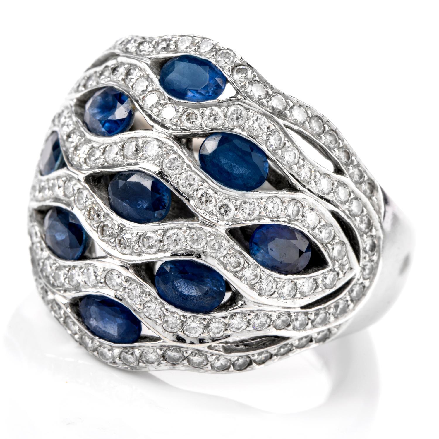 This stunning Diamond and Sapphire Dome ring was inspired in a 

flowing water motif and crafted in 18K white gold. 

Vibrant blue oval shaped Sapphire run vertically across

the finger throughout the waves of white Diamonds.

Diamonds weigh appx.