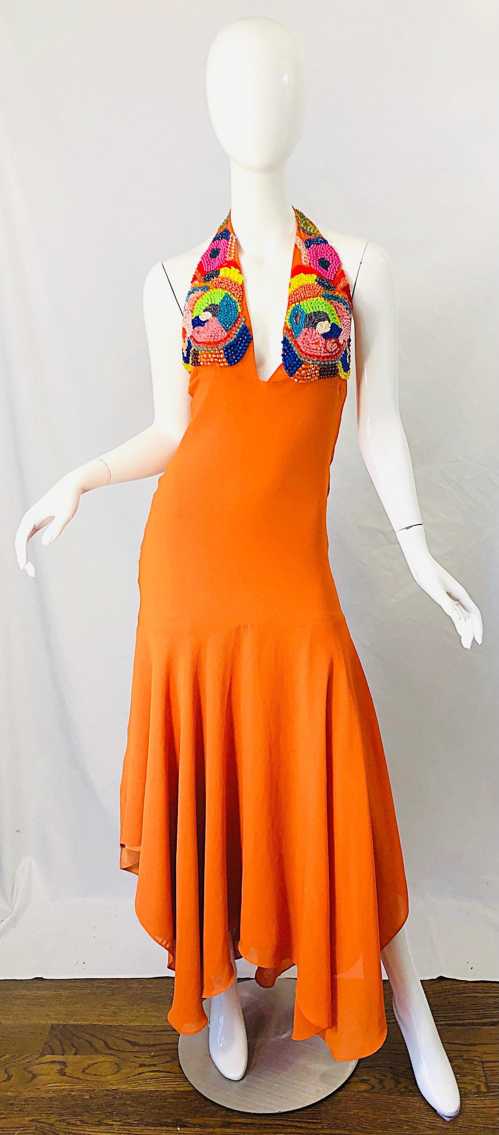Amazing 90s does 70s bright orange beaded handkerchief hem crepe chiffon halter flamenco style maxi dress gown ! Features a plunging neckline with hundreds of hand-sewn beads in hot pink, yellow, green, turquoise beads adorn the bust. Simply slips
