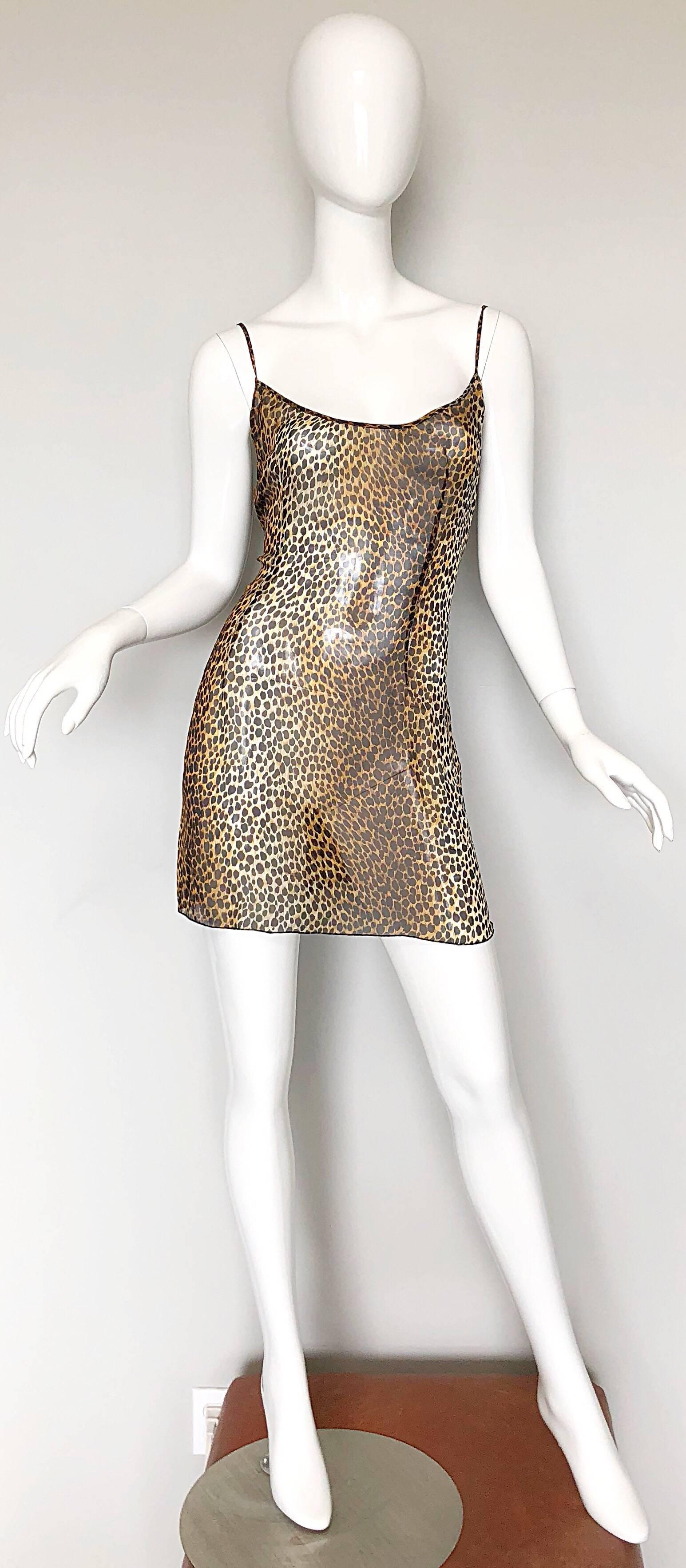 Sexy, yet flirty 90s DOLCE AND GABBANA leopard print semi sheer silk chiffon mini dress or top! Features allover classic animal print throughout. Hidden zipper up the side with hook-and-eye closure. Great layered with just a bra, or over jeans or